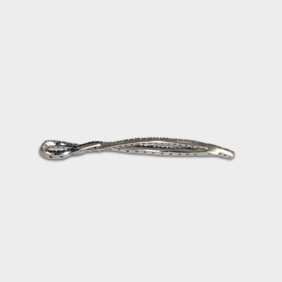 14k white gold and diamond infinity style pendant.
Stamped 14k and weighs 3.5 grams.
The white round brilliant diamonds are H,i, j color range, Vs to Si clarity.
The brown diamonds were color enhanced and are Si clarity.
There is a total of .50