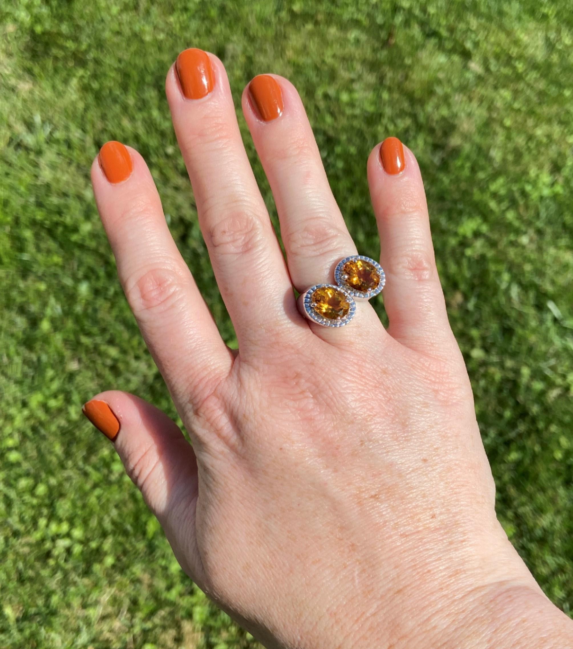 What's better than one exceptionally colored citrine? Two! This modern iteration of the famous toi et moi style ring features two golden honey-colored citrines totaling 4.65tcw. 

