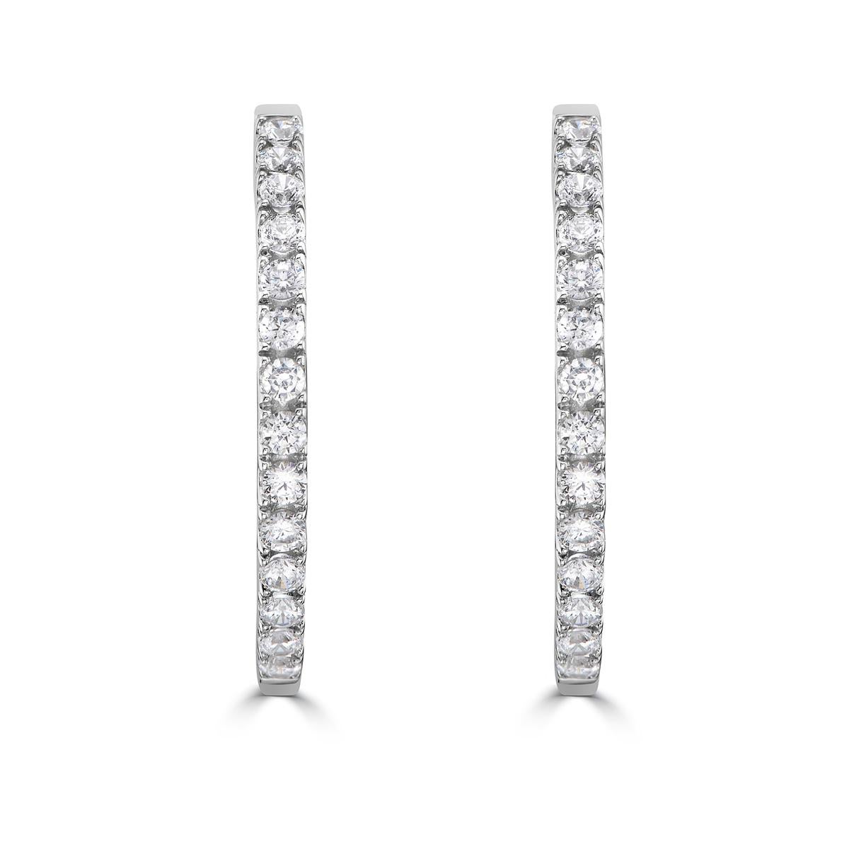Elevate your everyday style with this diamond and 14k gold hoop earrings. As the perfect piece to wear every day, these diamond hoops are an Essential for your jewelry collection. These hoops are a classic design with standout diamonds that give an
