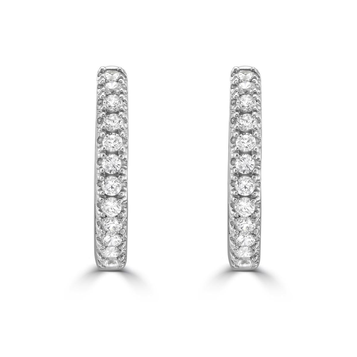 Elevate your everyday style with this diamond and 14k gold huggie hoop earrings. As the perfect piece to wear every day, these diamond huggies are an Essential for your jewelry collection. These huggies are a classic design with standout diamonds