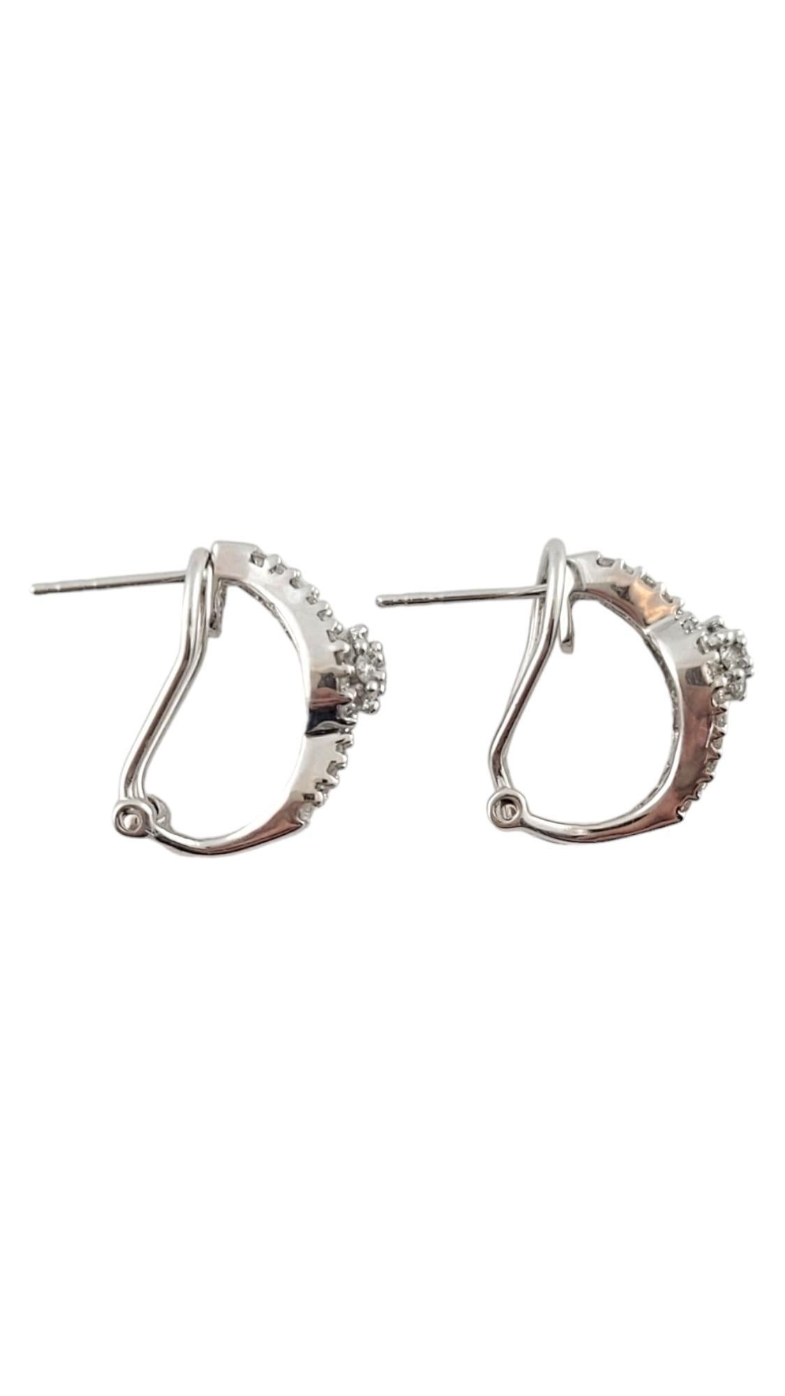 Vintage 14K White Gold Diamond Hoop Earrings

This gorgeous set of 14K white gold hoop earrings feature 24 beautiful baguette cut diamonds and 70 sparkling round brilliant cut diamonds!

Approximate total diamond weight: .64 cts

Diamond color: