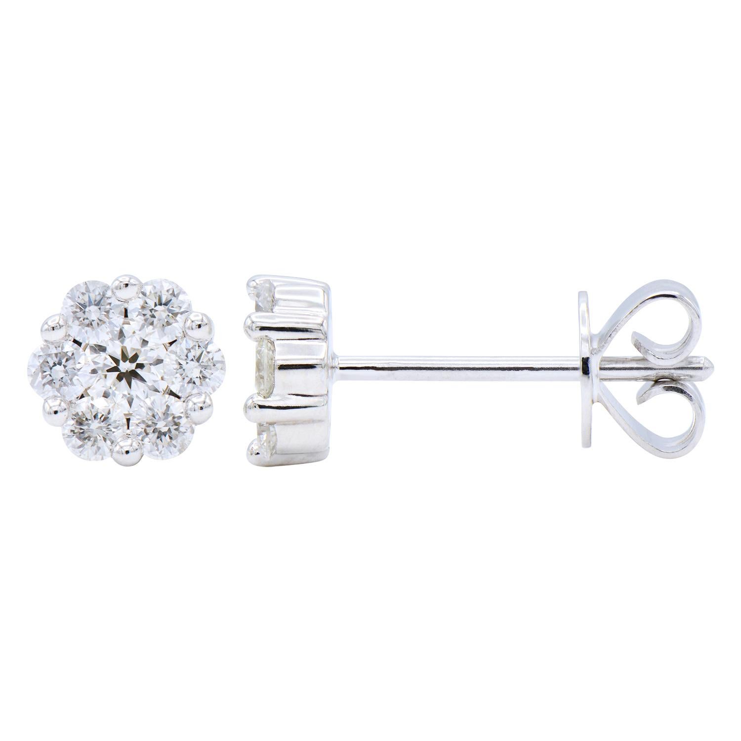 These stunning stud earrings are made with 1.1 grams of 14 karat white gold and contain 14 round diamonds. The diamonds are VS2, G color, and have a total carat weight of .41 ct. These are stud earrings that have a push back with an extra notch for