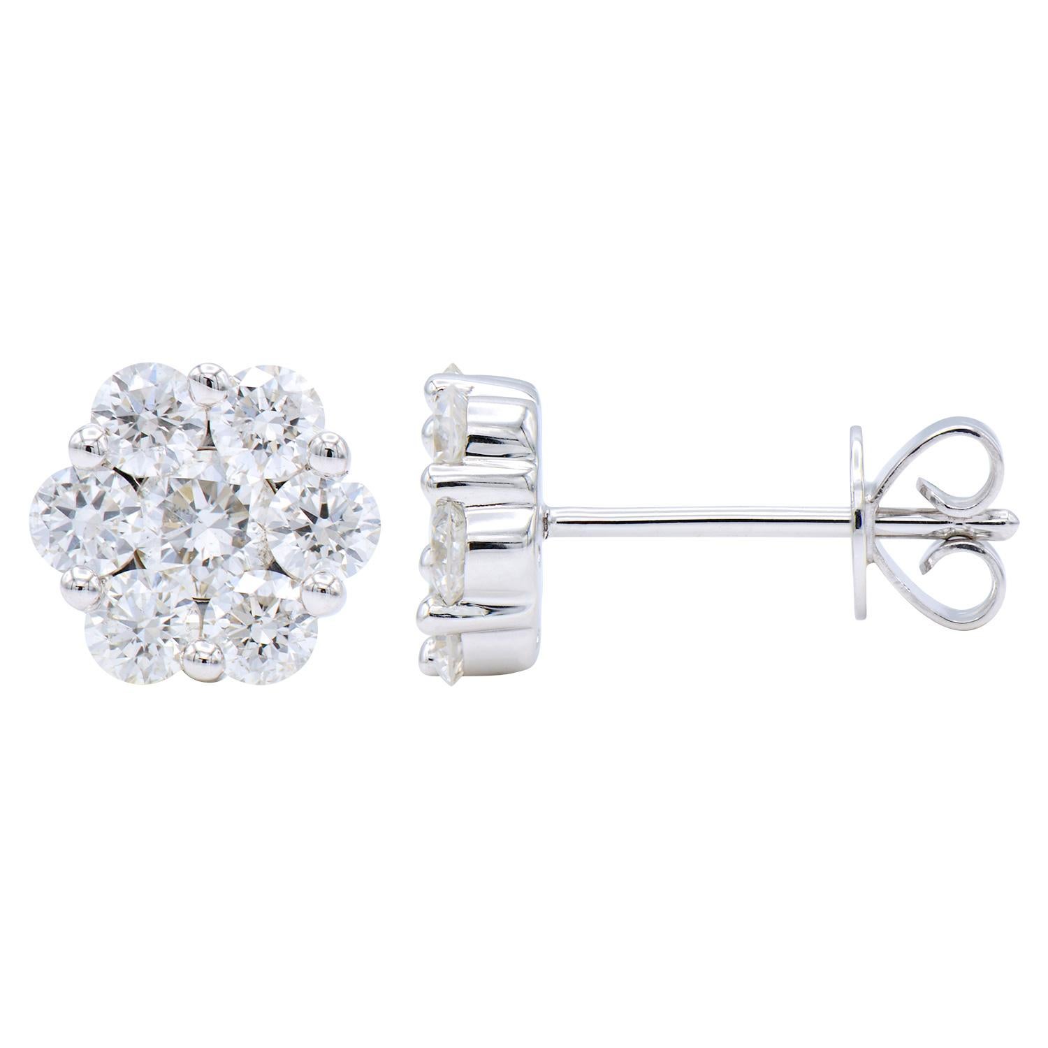 These stunning stud earrings are made with 1.6 grams of 14 karat white gold and contain 14 round diamonds. The diamonds are VS2, G color, and have a total carat weight of 1.04 ct. These are stud earrings that have a push back with an extra notch for
