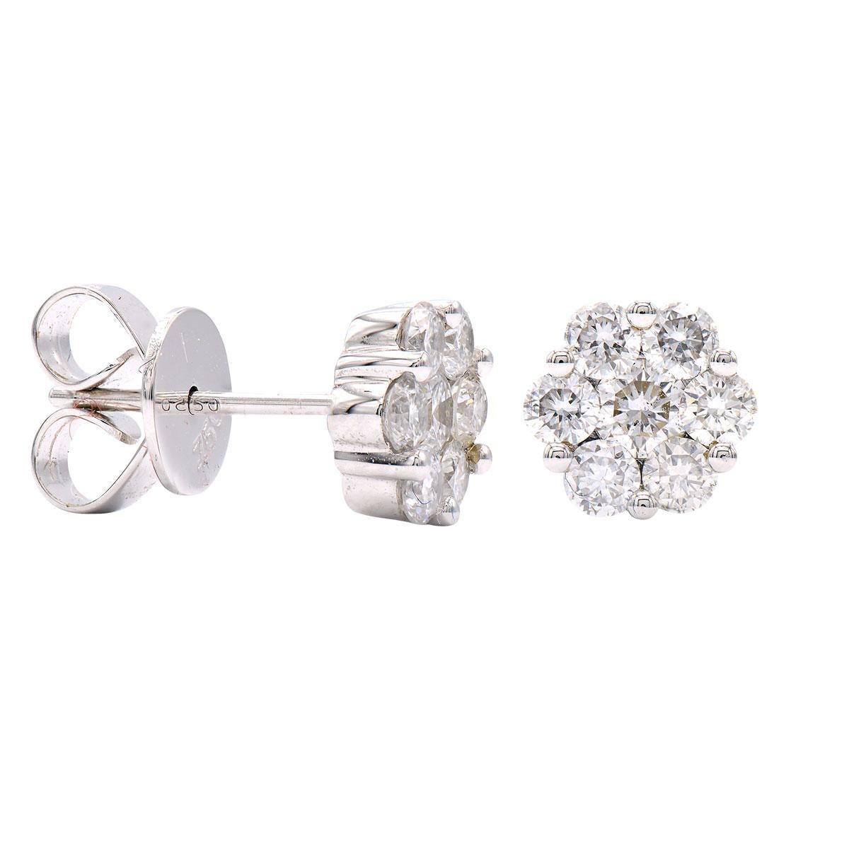 These stunning stud earrings are made with 1.4 grams of 14 karat white gold and contain 14 round diamonds. The diamonds are VS2, G color and have a total carat weight of .59 ct. These are stud earrings that have a push back with an extra notch for