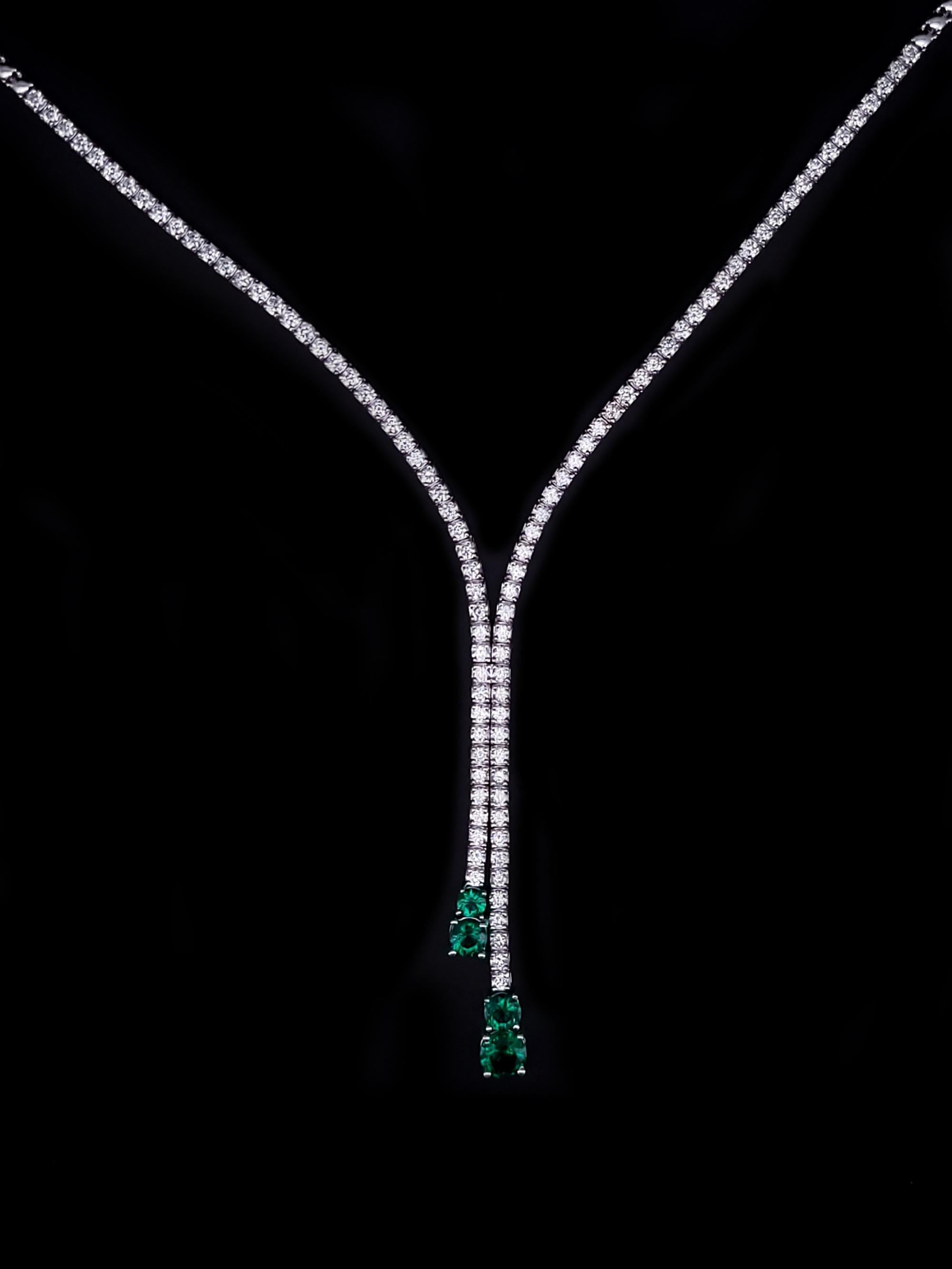 14K WHITE GOLD NECKLACE WITH COLUMBIAN EMERALDS AND DIAMONDS

Material: 14k White Gold
Width: 2.0mm
Length: 20 inches
Weight: 17.1 grams
Diamond Quantity: 97 stones
Diamond Dimension: 2.0mm
Diamond Clarity: VS1
Diamond Color: G
Diamond Weight: