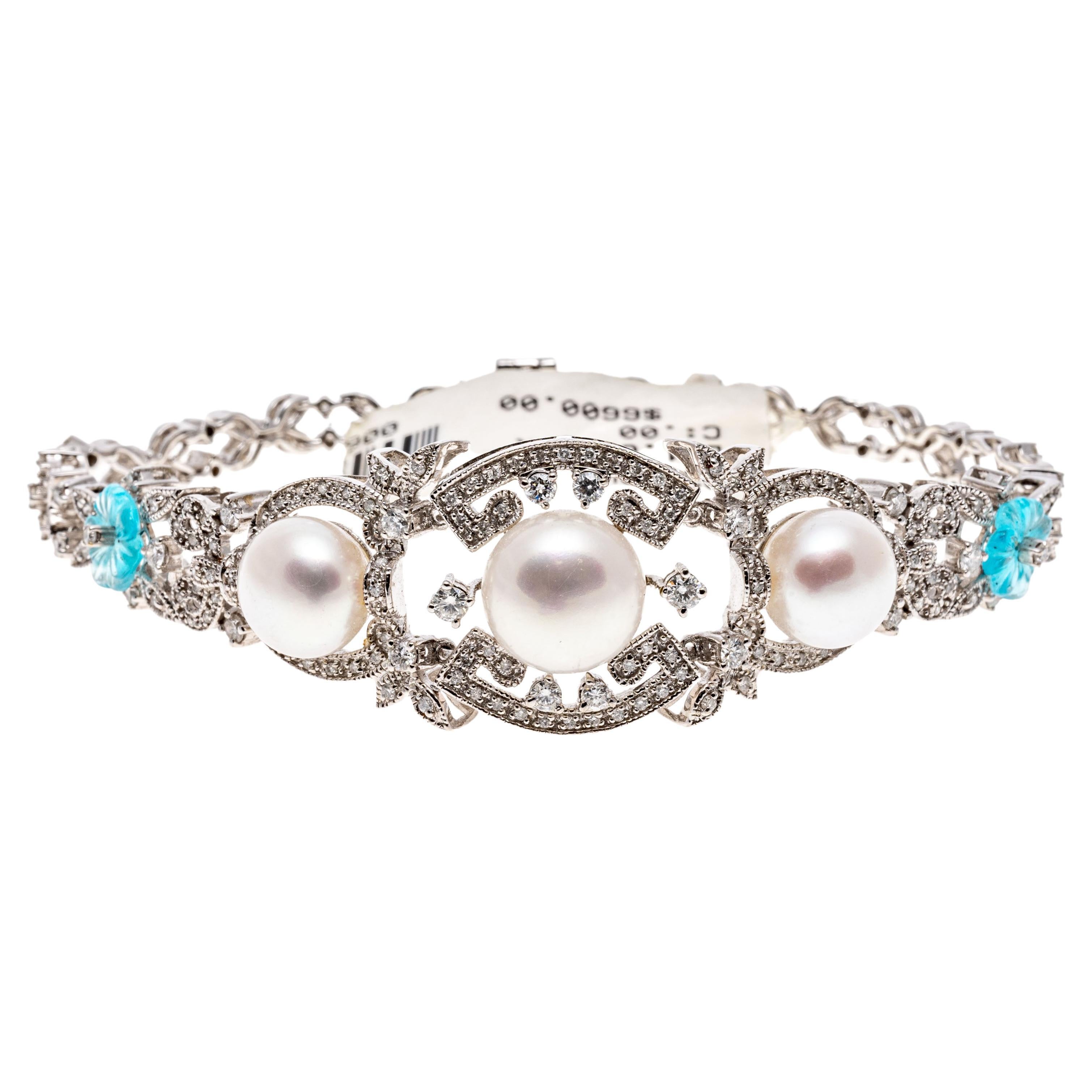 14k white gold bracelet. This amazing modern bracelet has a fabulous Edwardian style and contains a center round, 10mm cultured button pearls which have a pinkish white tone, flanked by two matching 9mm cultured button pearls. The pearls are