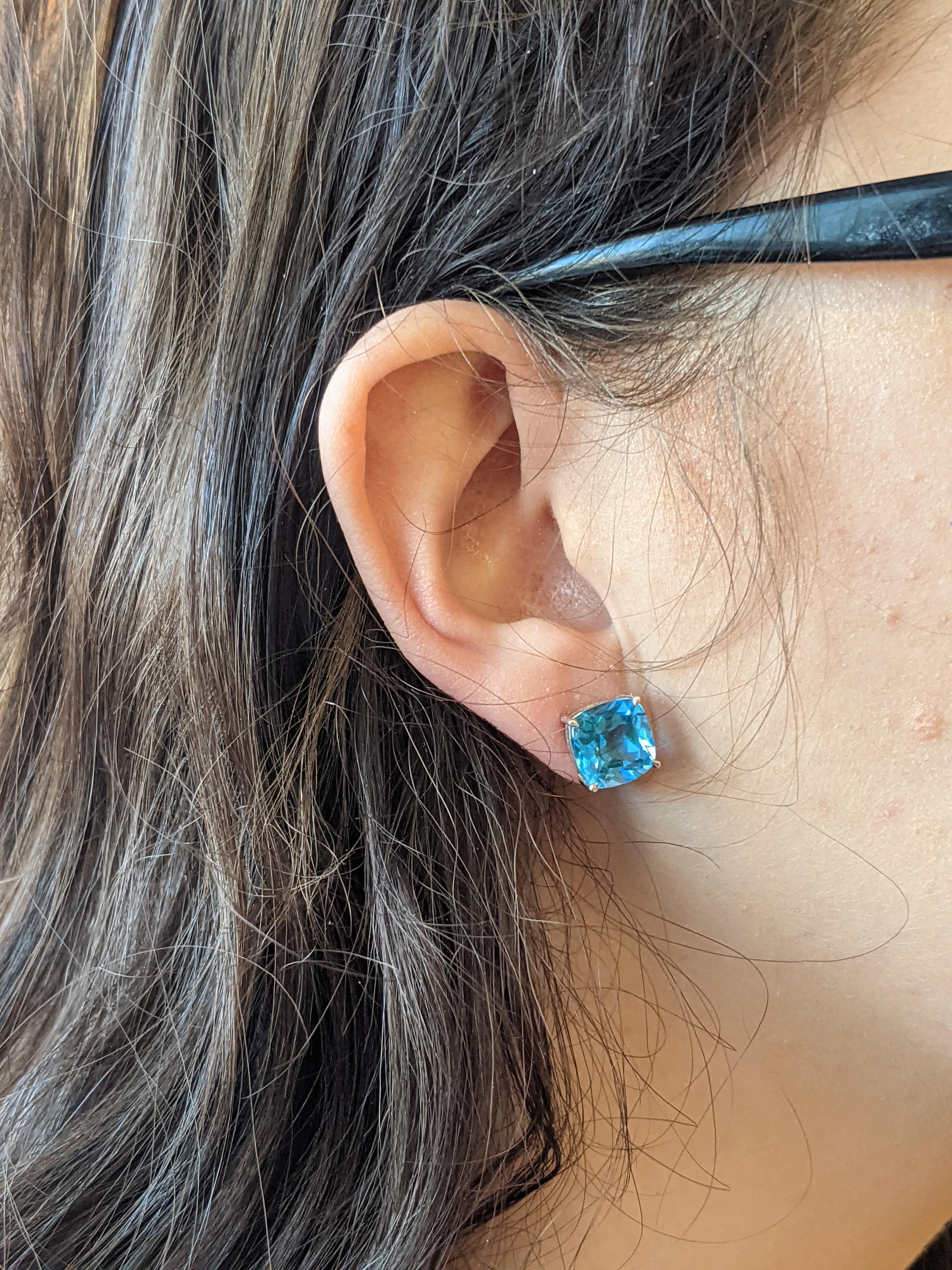 In a beautiful clash of flashing 14k white gold and brilliant blue topaz, these cushion-cut stud earrings check every box! The elegant shape and finery of the gemstones mean they are the ideal accessory for a night out, but their versatile