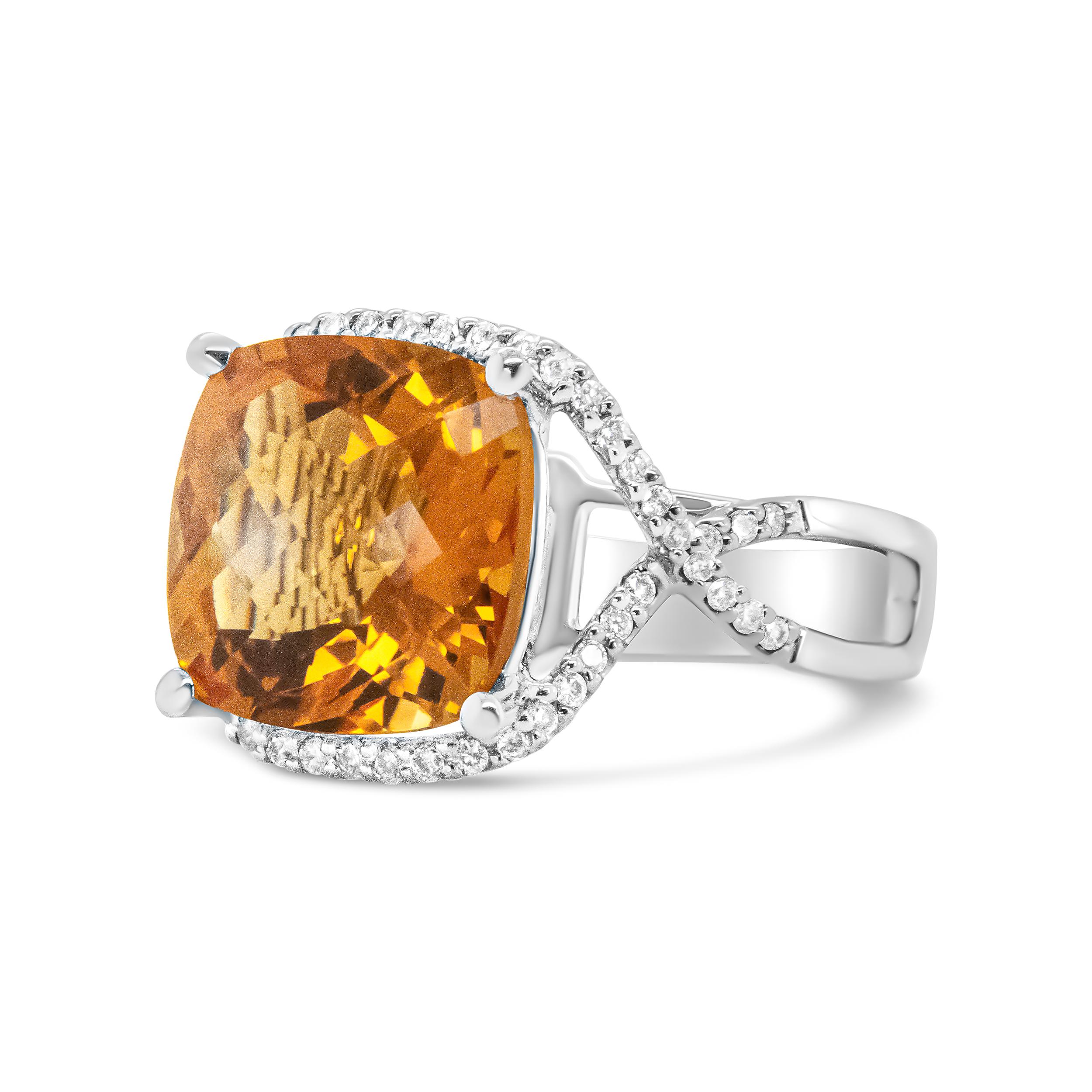 Fall in love with the allure of this 14k white gold ring with a halo of pave set round diamonds that encircle a glittering 12mm cushion-cut yellow citrine gemstone cradled in a prong setting. The sparkling white diamonds cascade along a path where