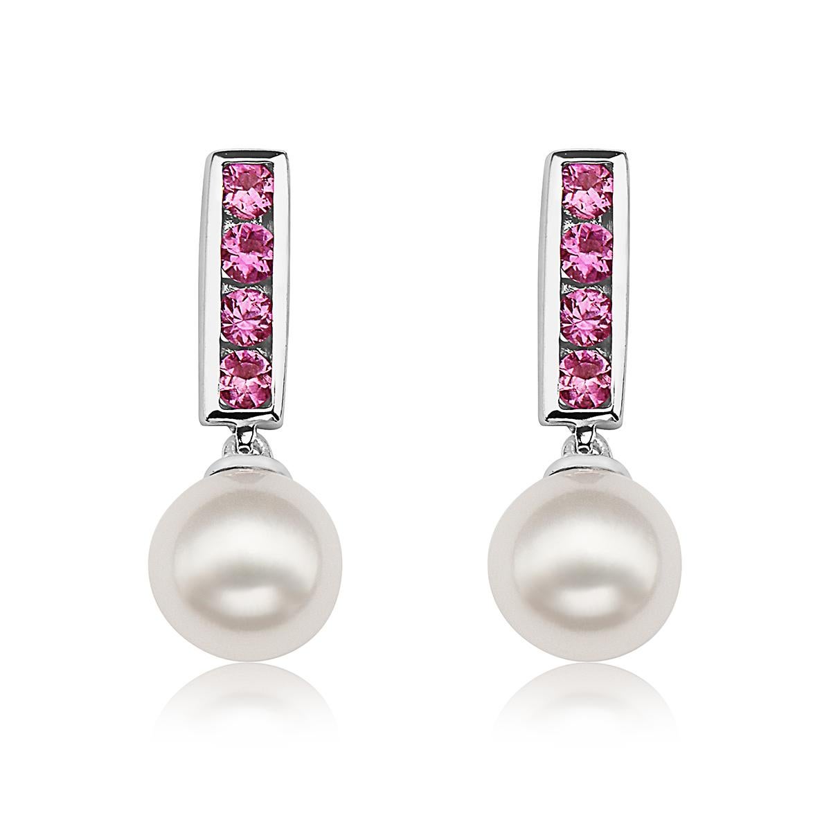 Gorgeous Akoya Pearls measuring 7mm dangle from channel-set genuine pink sapphires set in genuine 14K White Gold. This is a modern classic and sure to add a pop of color to your look. Great for everyday wear, these earrings are as versatile as they
