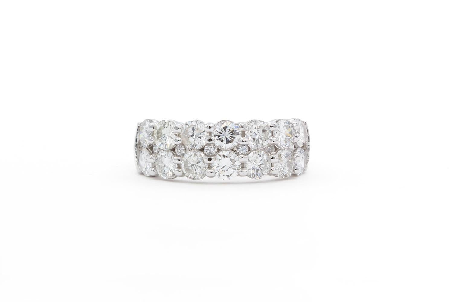 We are pleased to offer this Brand New 14k White Gold & Diamond 2 Row Shared Setting Fashion Ring. This is not your typical two row band, it actually has smaller hidden diamonds in between the larger diamonds for added bling! It features 2.26ctw