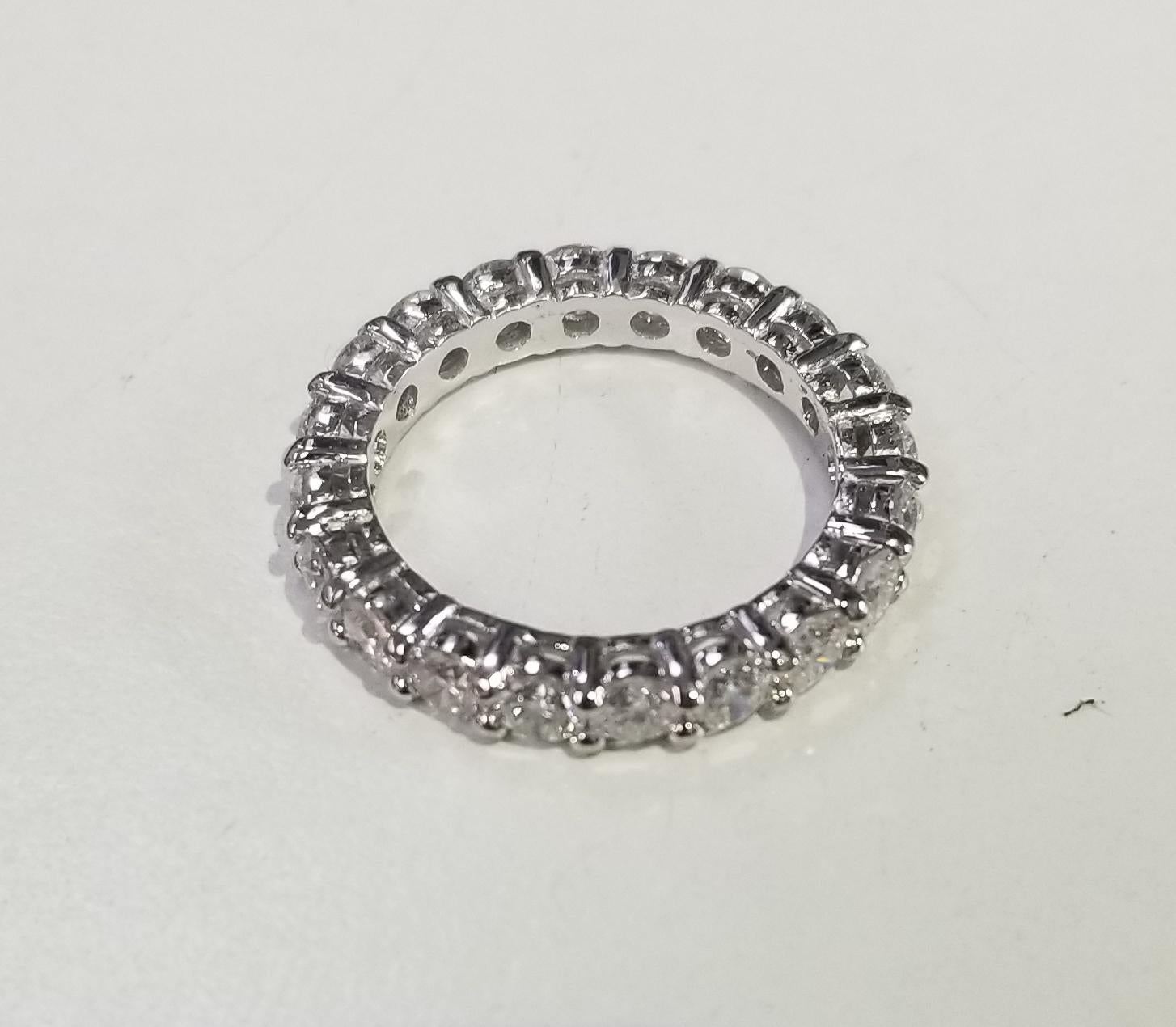 Round Cut 14 Karat White Gold Diamond 2.50 Carat Eternity Ring with Shared Prongs For Sale