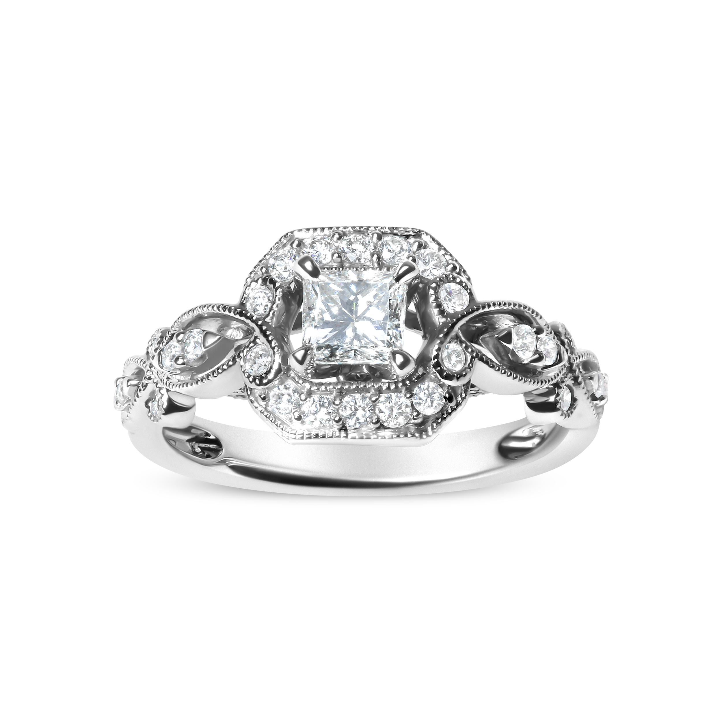 Realizzato in oro bianco rodiato 14 carati, questo splendido anello di fidanzamento incarna l'eleganza grazie al suo diamante centrale con taglio a principessa del peso di 3/8 carati, ottenuto in modo naturale per catturare magnificamente la luce.