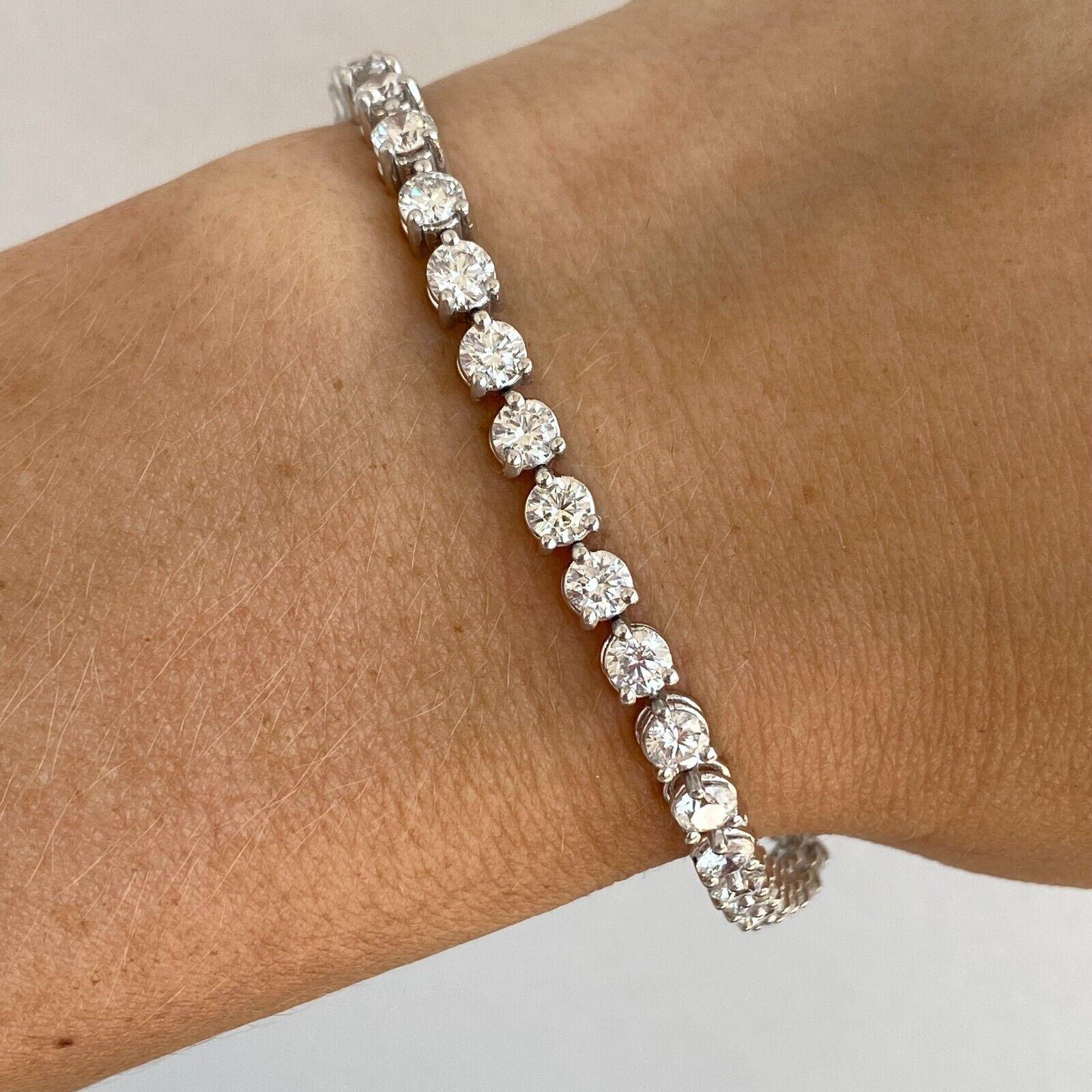 DIAMOND TENNIS BRACELET 
Specifications:
    main stone:ROUND DIAMONDS
    carat total weight: APPROXIMATELY 7.70CTW
    color:F-G
    clarity:SI1
    metal:14K WHITE gold
    type:BRACELET
    weight:11.9 gr
    LENGHT:7 INCH
    hallmark:585

