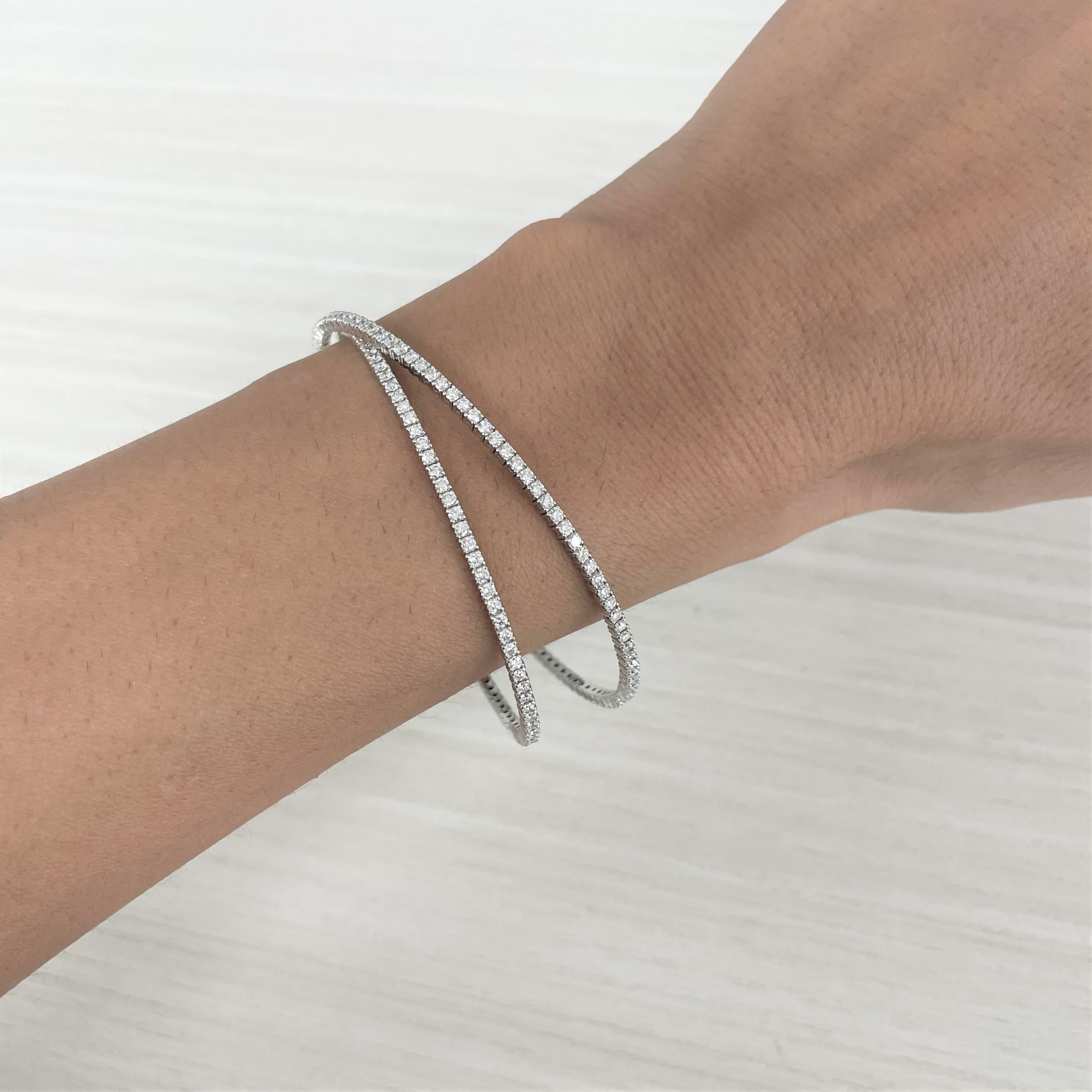 Quality Flexible Bangle: Made from real 14k gold and 180 glittering white approximately 3.40 ct. Certified diamonds, featuring a single row of white diamonds flexible diameter for comfort with a color and clarity of GH-SI

Surprise Your Loved One