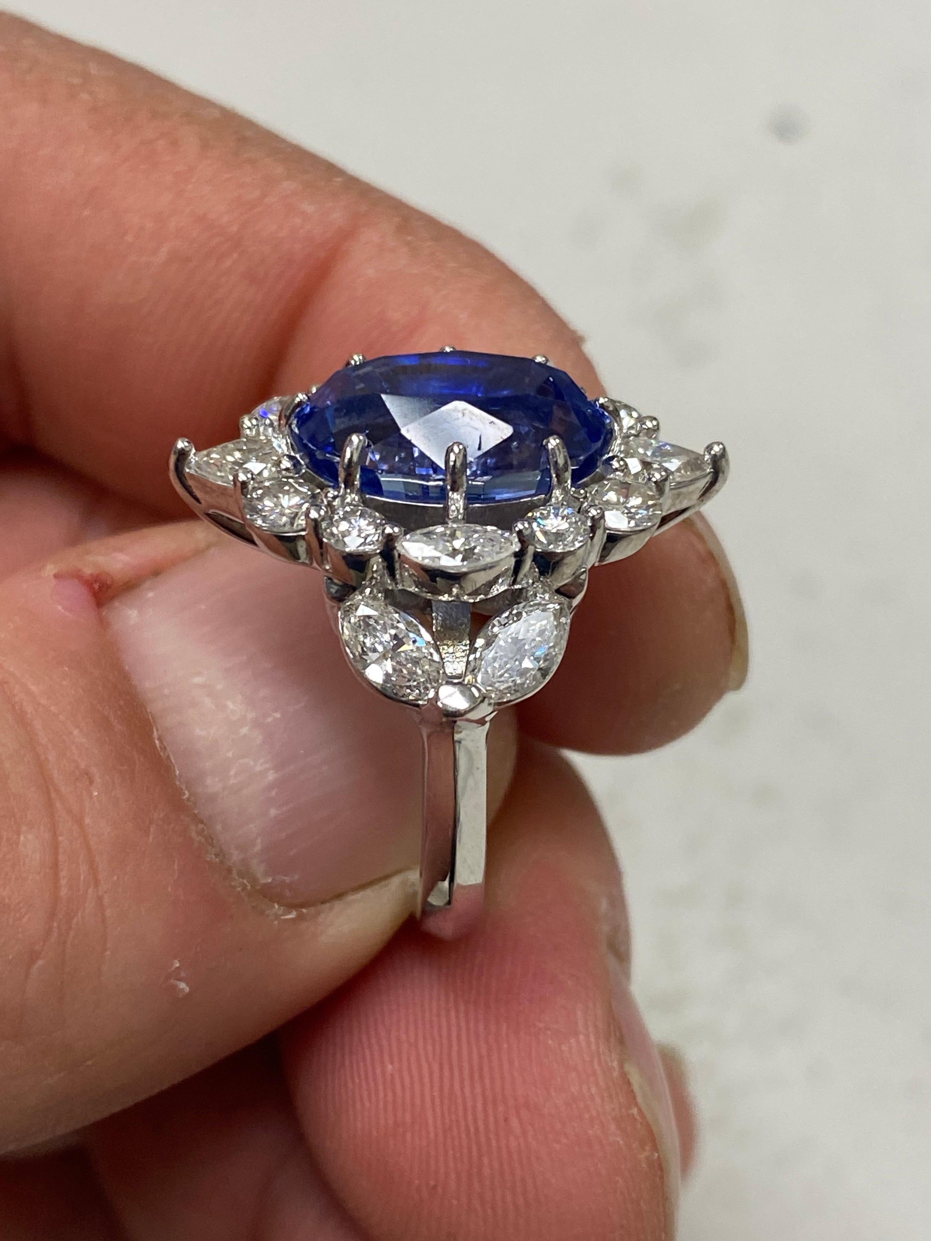 DeKara Design Collection 

Metal- 14K White Gold, .583.

Stones- 7.61 Carat No Heat Blue Sapphire (Although there is no origin on the certificate it is from Sri Lanka) 8 Round Diamonds, 2 Pear Shape Diamonds, 6 Marquis Diamoinds, G-H Color VS2-SI2