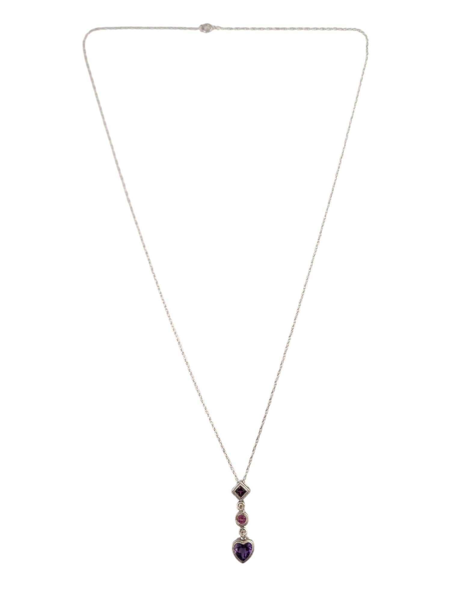 14K White Gold Diamond, Amethyst, Pink Topaz & Rhodolite Garnet Necklace 

This stunning necklace features a 14K white gold chain paired with a gorgeous pendant decorated with one heart shaped cut amethyst, one round cut pink topaz, one square cut