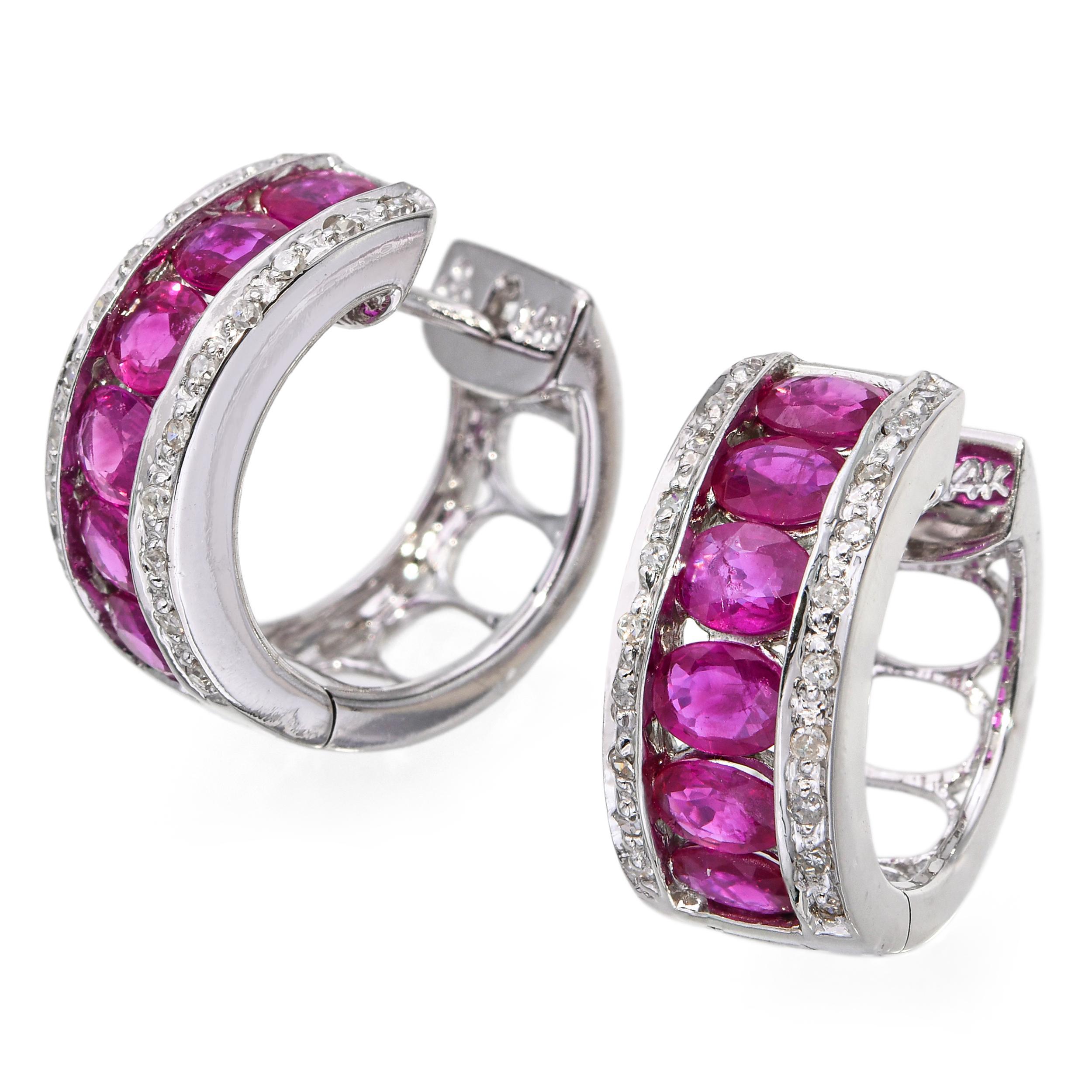 These vintage hoop earrings are crafted in elegant 14k white gold, featuring a total of 1.98tcw of vibrant rubies accented by sparkling diamonds. The alternating ruby and diamond design creates a luxurious contrast, catching the light beautifully