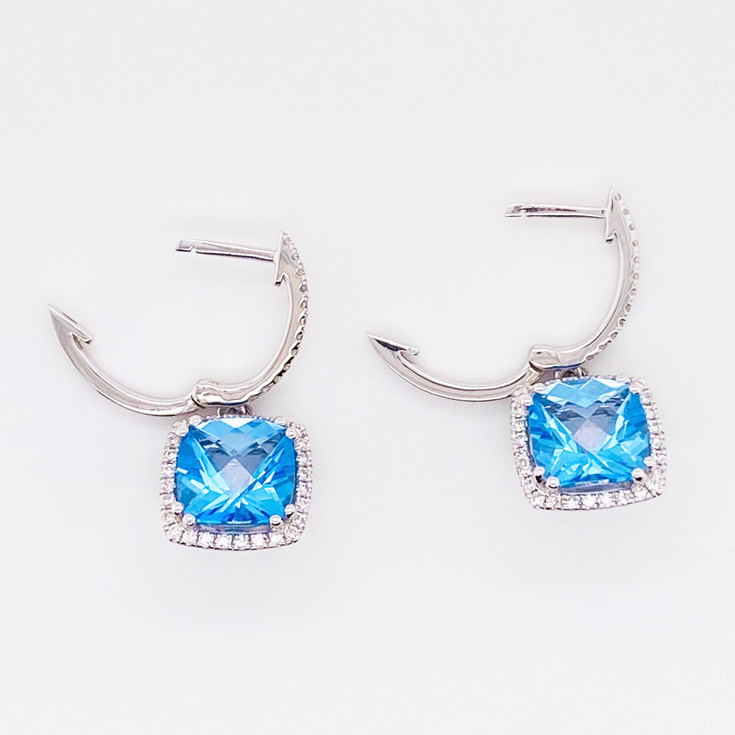 14 Karat White Gold 
Blue topaz and Diamond
0.44 carat diamond
5.19 carat blue topaz
40 total diamonds on each earring 