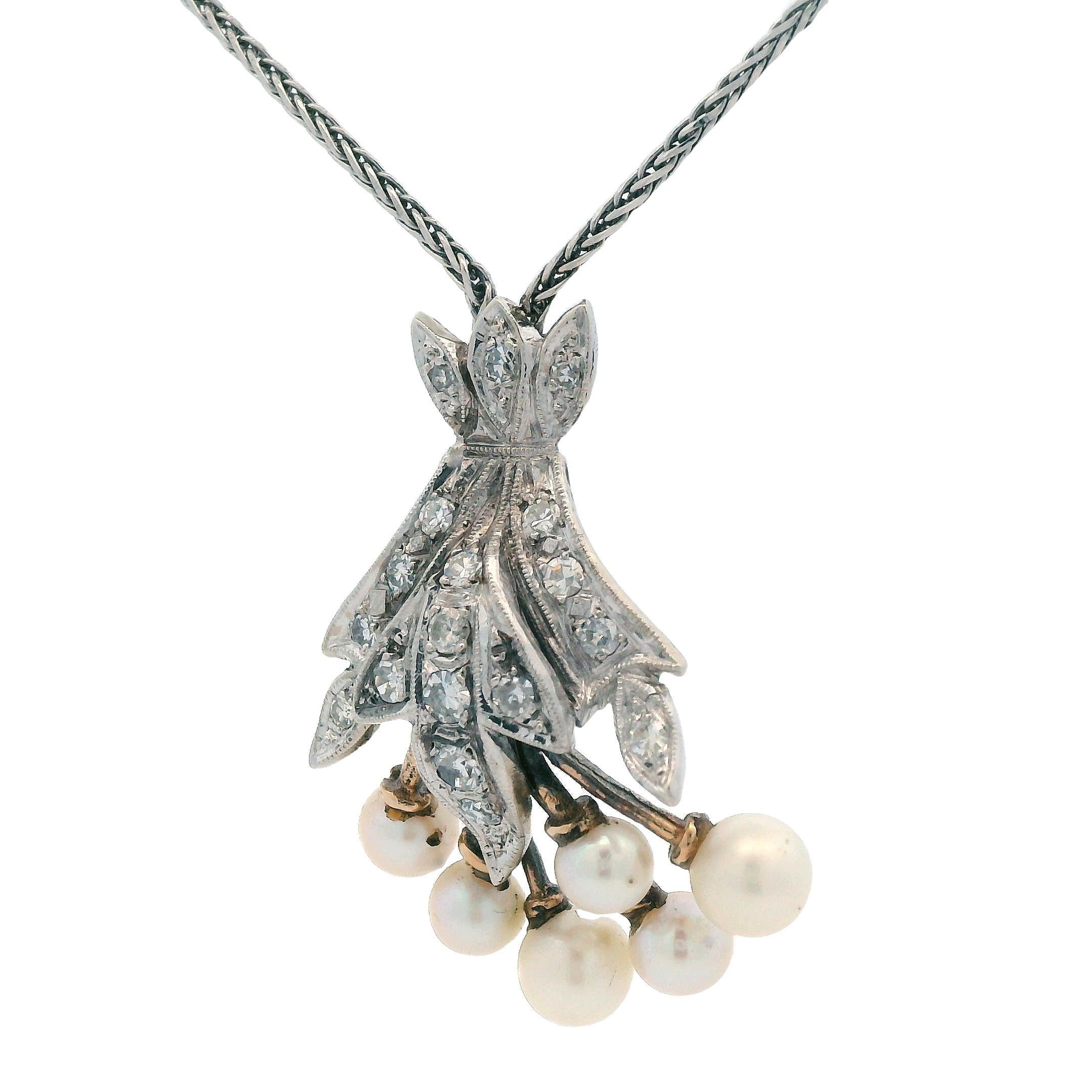 This stunning pendant necklace is made in 14k white gold with round cut diamond and white cultured pearls. This necklace is the perfect collection item for anyone looking to add a set of pearls to their set, while still maintaining the natural