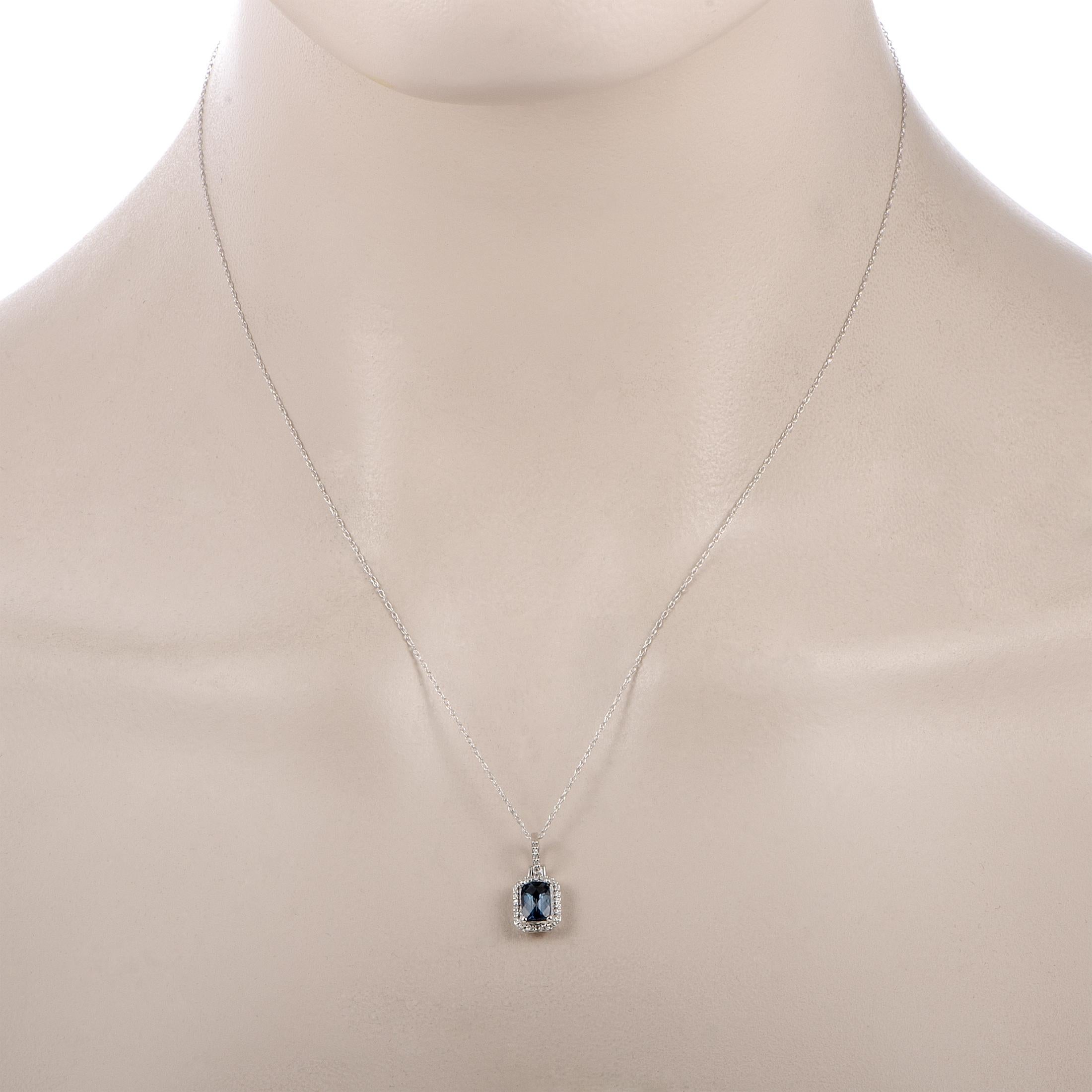 This necklace is crafted from 14K white gold, boasting an 18.00” chain with spring ring closure and a pendant that measures 0.65” in length and 0.31” in width. The necklace weighs 1.8 grams and is set with a London topaz and a total of 0.09 carats