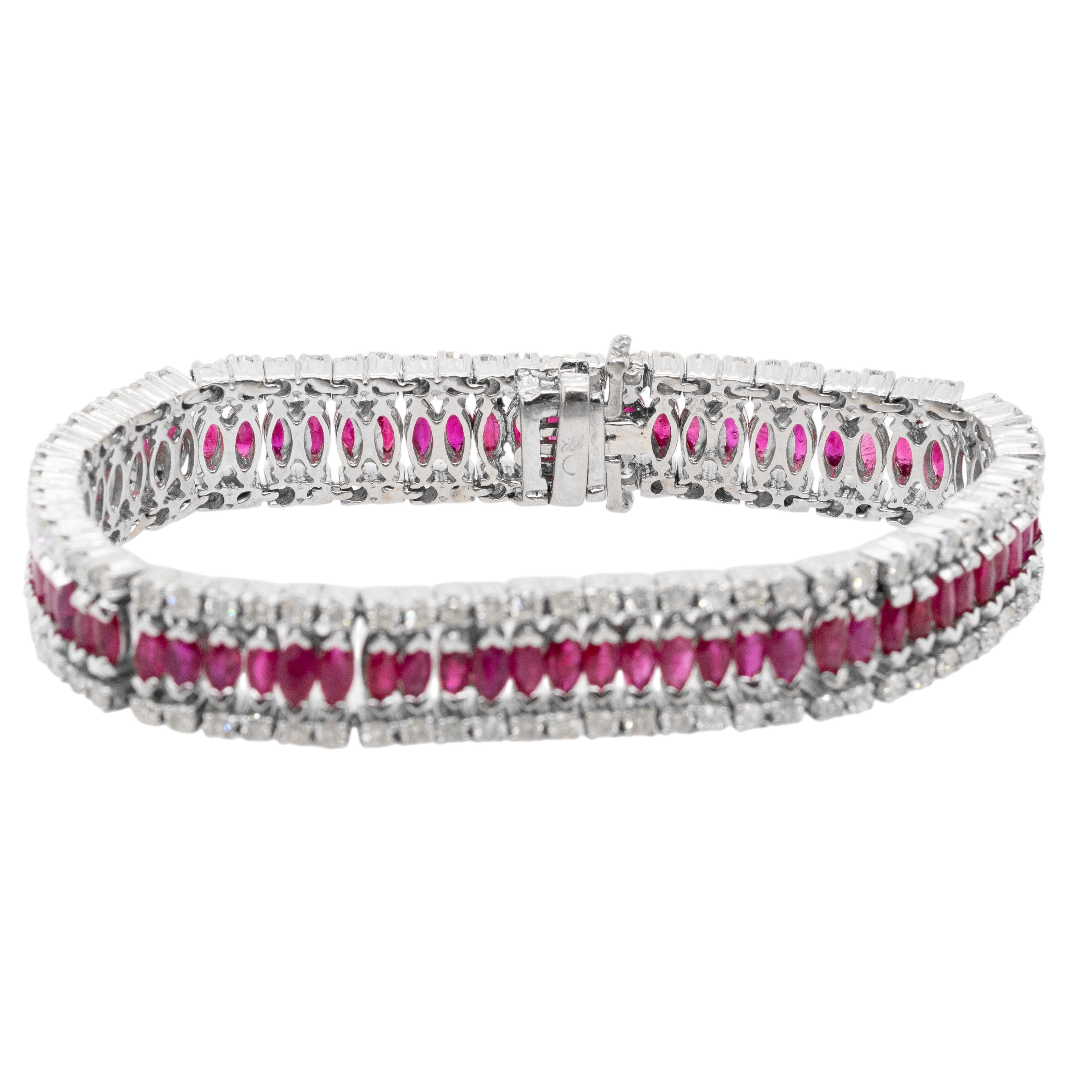This stunning wide bracelet is crafted from 14k white gold and features an impressive combination of approximately 2.70 carats of natural round brilliant diamonds and 6.80 carats of vibrant rubies, creating a bold yet refined look. Weighing in at