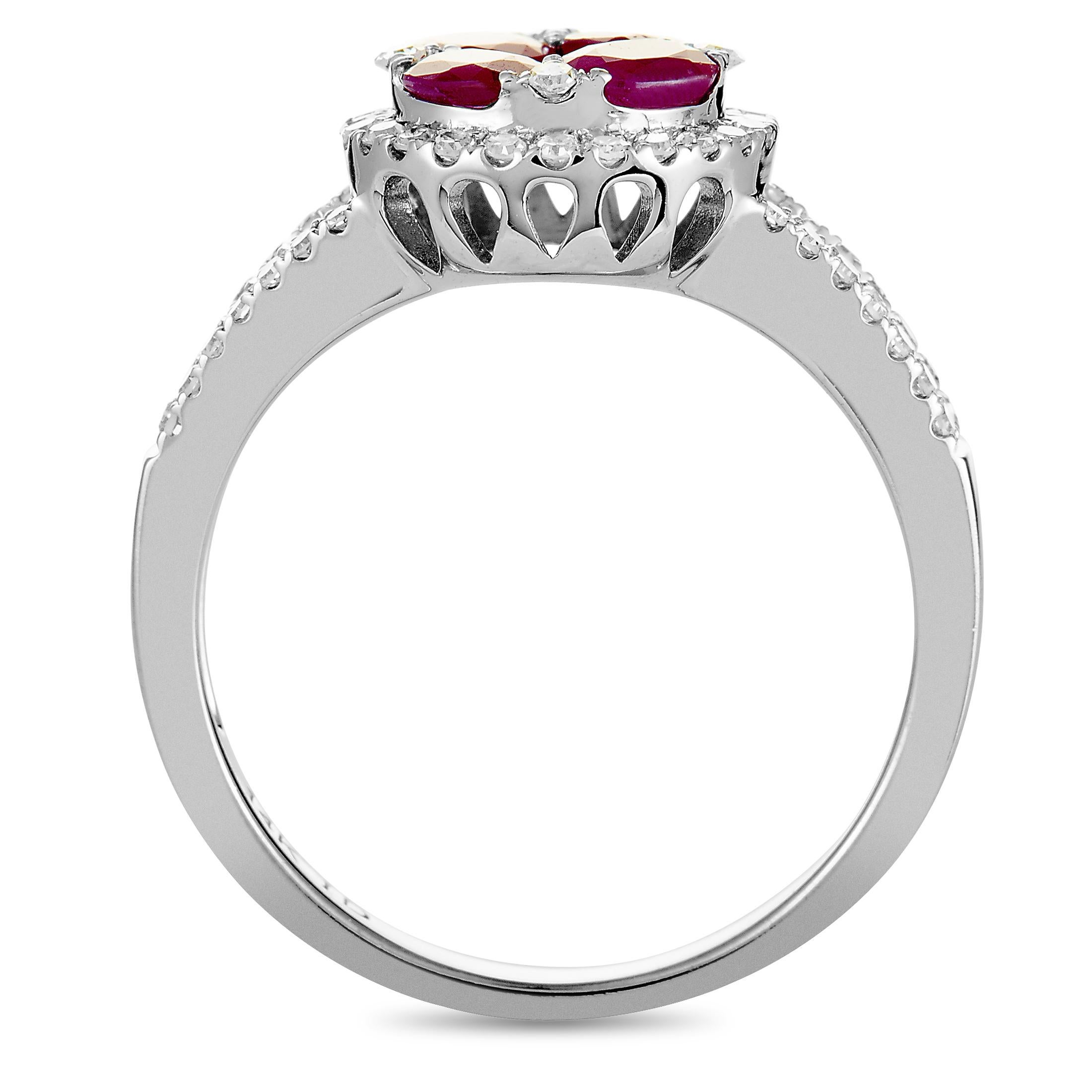 This ring is crafted from 14K white gold and set with rubies and with diamonds that amount to 0.33 carats. The ring weighs 3.9 grams, boasting band thickness of 2 mm and top height of 6 mm, while top dimensions measure 20 by 10 mm.
 
 Offered in