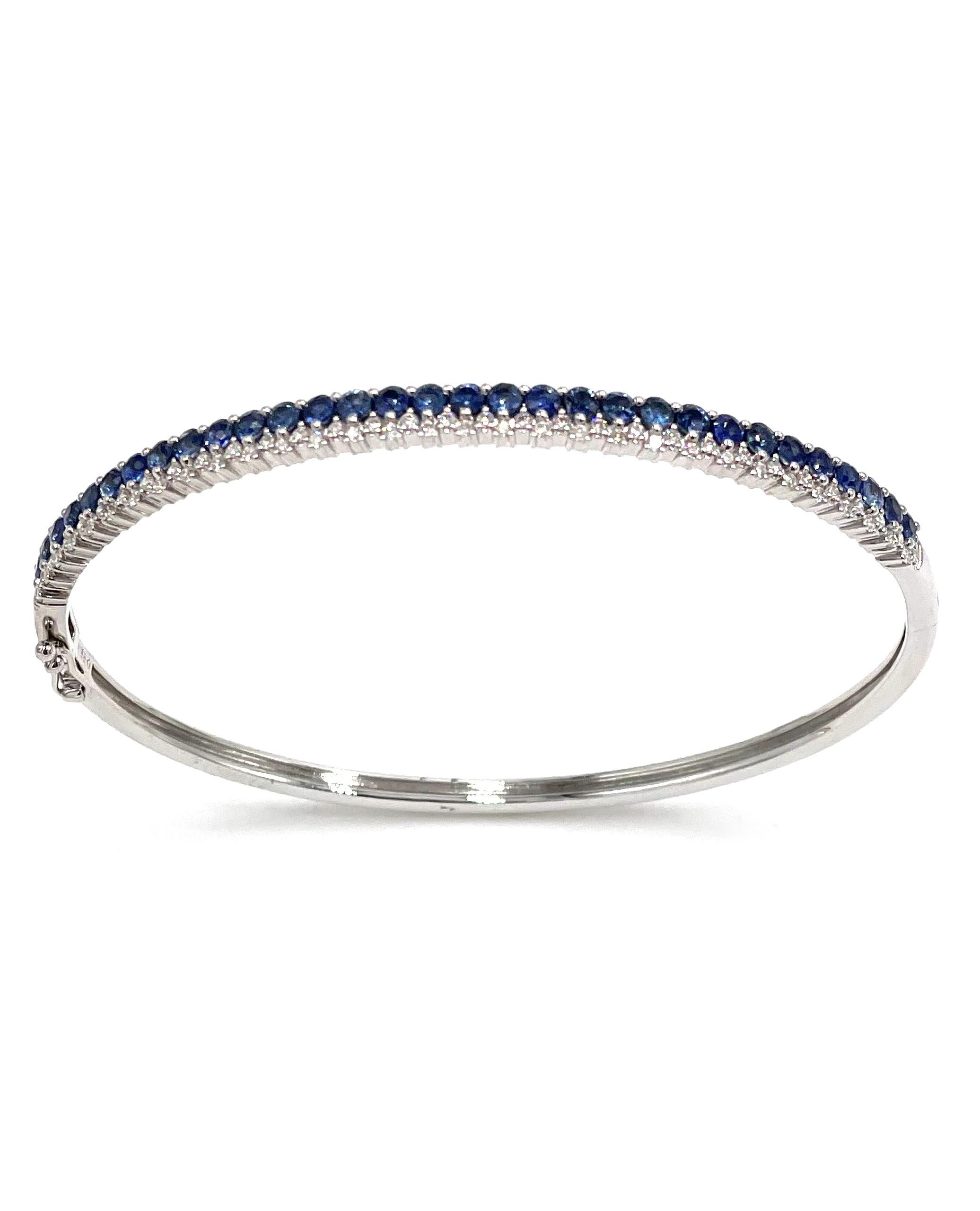 14K white gold bangle with 63 round brilliant-cut diamonds 0.46 carat and 31 round blue sapphires 2.18 carats.

* Diamonds are H color, SI clarity
* Figure 8 safety lock