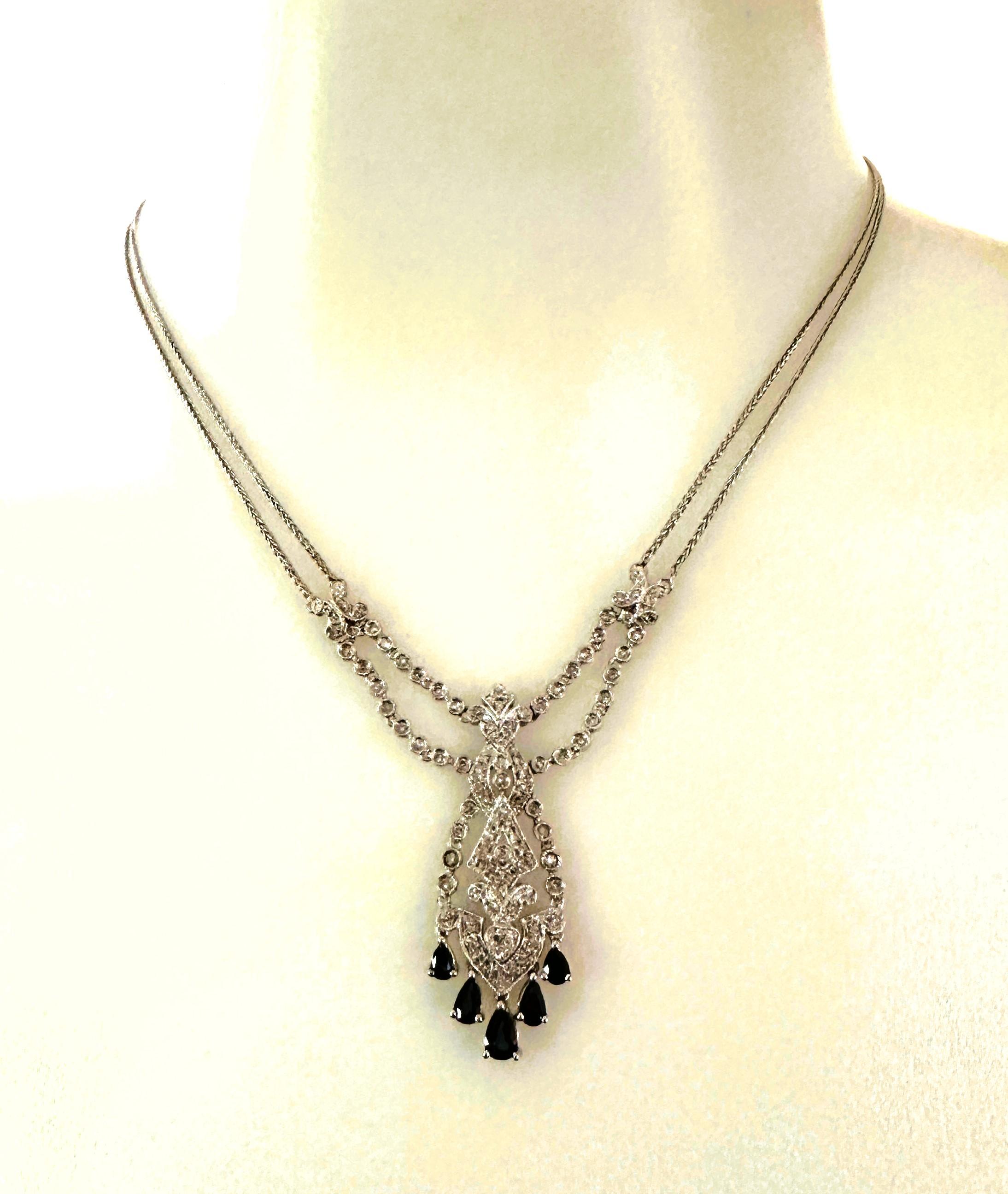 This is just a beautiful pendant necklace.  It's so elegant and hangs beautifully around the neck.  I just love it!  It is pre-owned but in excellent condition.  All together it has 92 diamond and 5 sapphires.  I've attached a copy of the appraisal