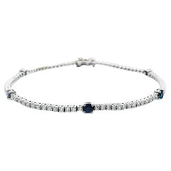 Bracelet tennis en or blanc 14 carats avec diamants et saphirs