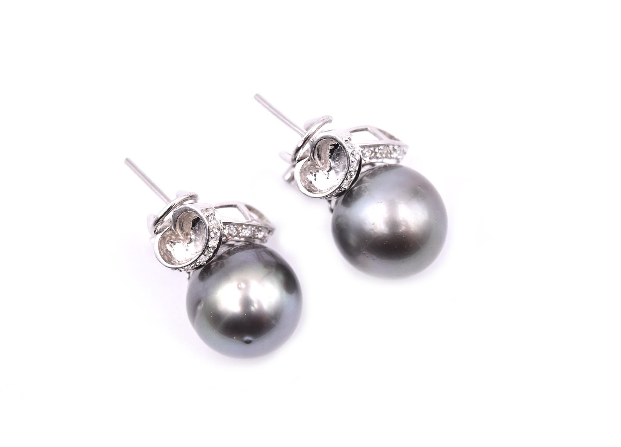 Designer: custom design
Material: 14k white gold
Pearls: 2 pearls approximate diameter is 12.25mm
Diamonds: 18 round brilliant cut= 0.10cttw 
Color: G
Clarity: VS
Fastenings: post with omega backs
Dimensions: earring are approximately 16.25mm in