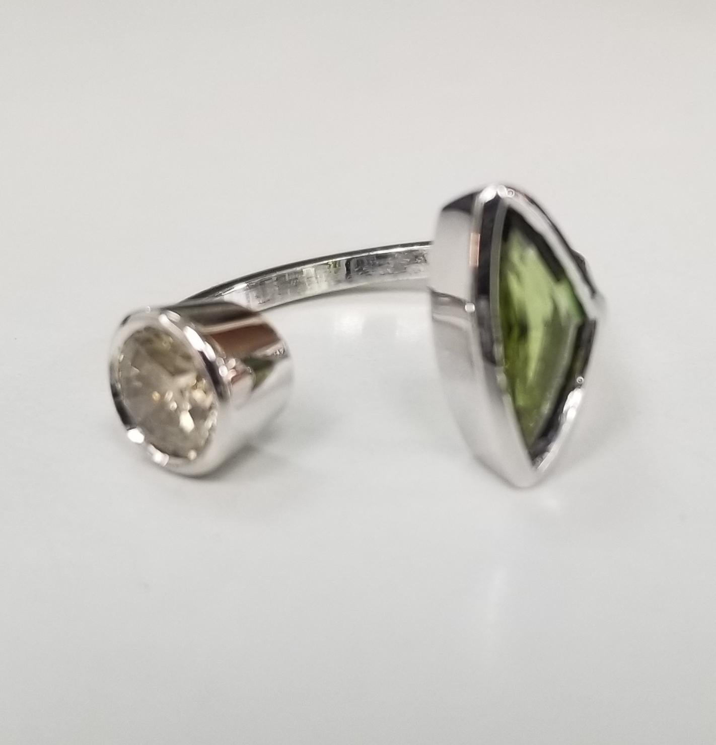 14K White Gold Tourmaline and Topaz split ring
Specifications:
    MAIN stone:   Diamond round .73cts.
    Additional stones:  Tourmaline .73cts.
    metal: 14K WHITE GOLD
    type: RING
    weight: 4.5 GRS 
    size: 6.25 US
*Pick your stones and