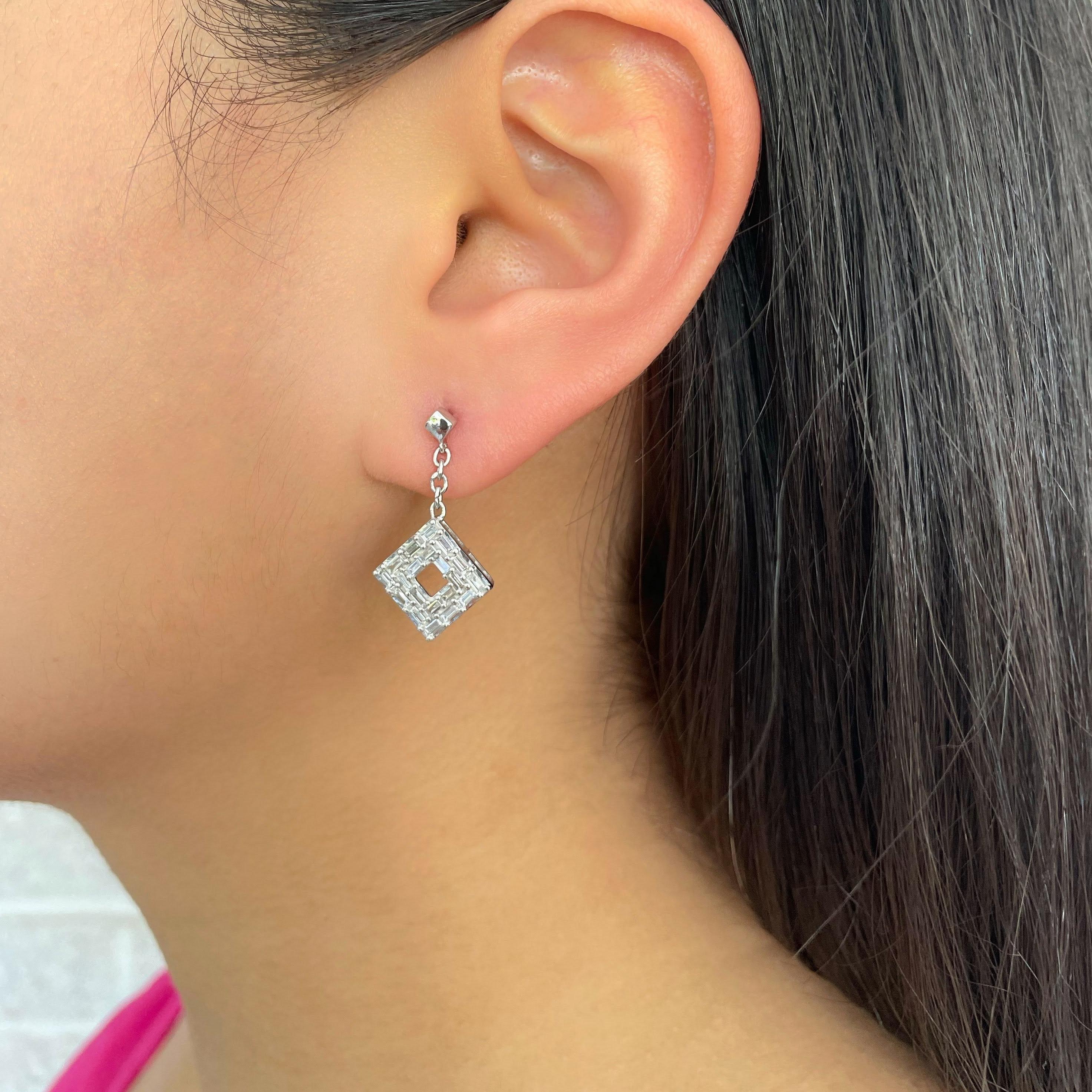 The 14K white gold dangling earrings feature solely baguette diamonds that give it a profound look but the delicate dangle is subtle enough for an everyday wear. Because of its universal style, these earrings are perfect for any occasion including