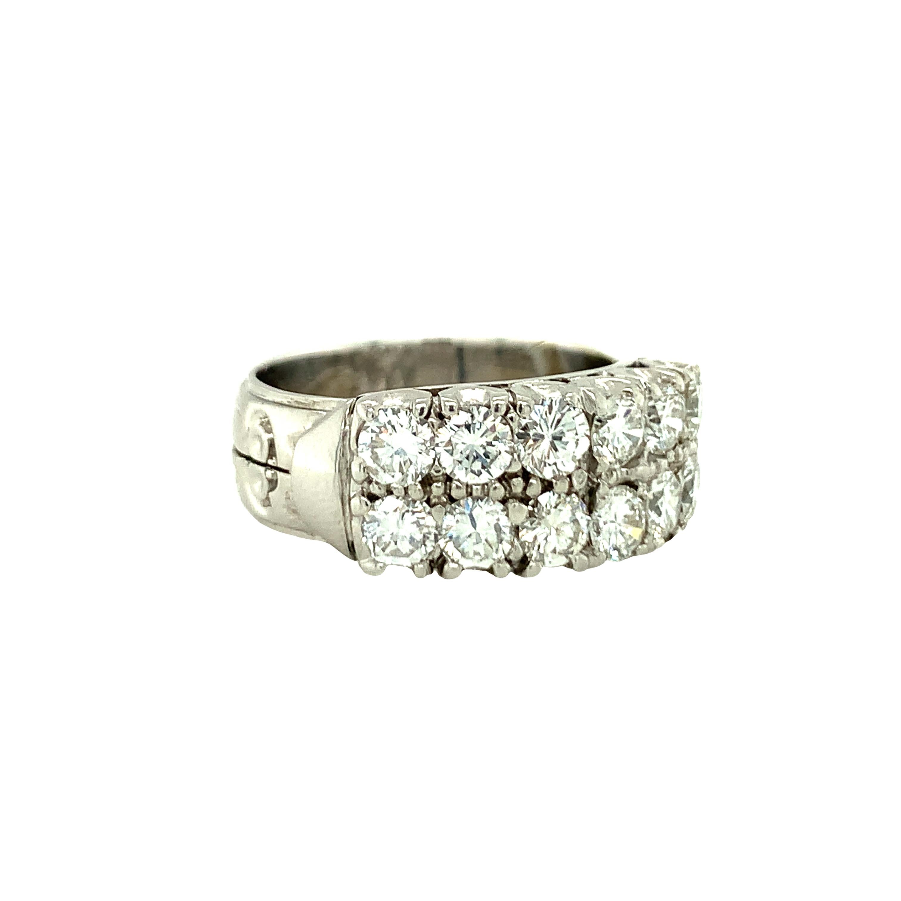 One 14K white gold diamond band featuring 12 prong set, round brilliant cut diamonds set upon two stacked rows totaling 2.18 ct. with J-K color and SI-1 clarity.  With hand engraved details on the band portion.  Measures 9 mm. wide and weighs 9.5