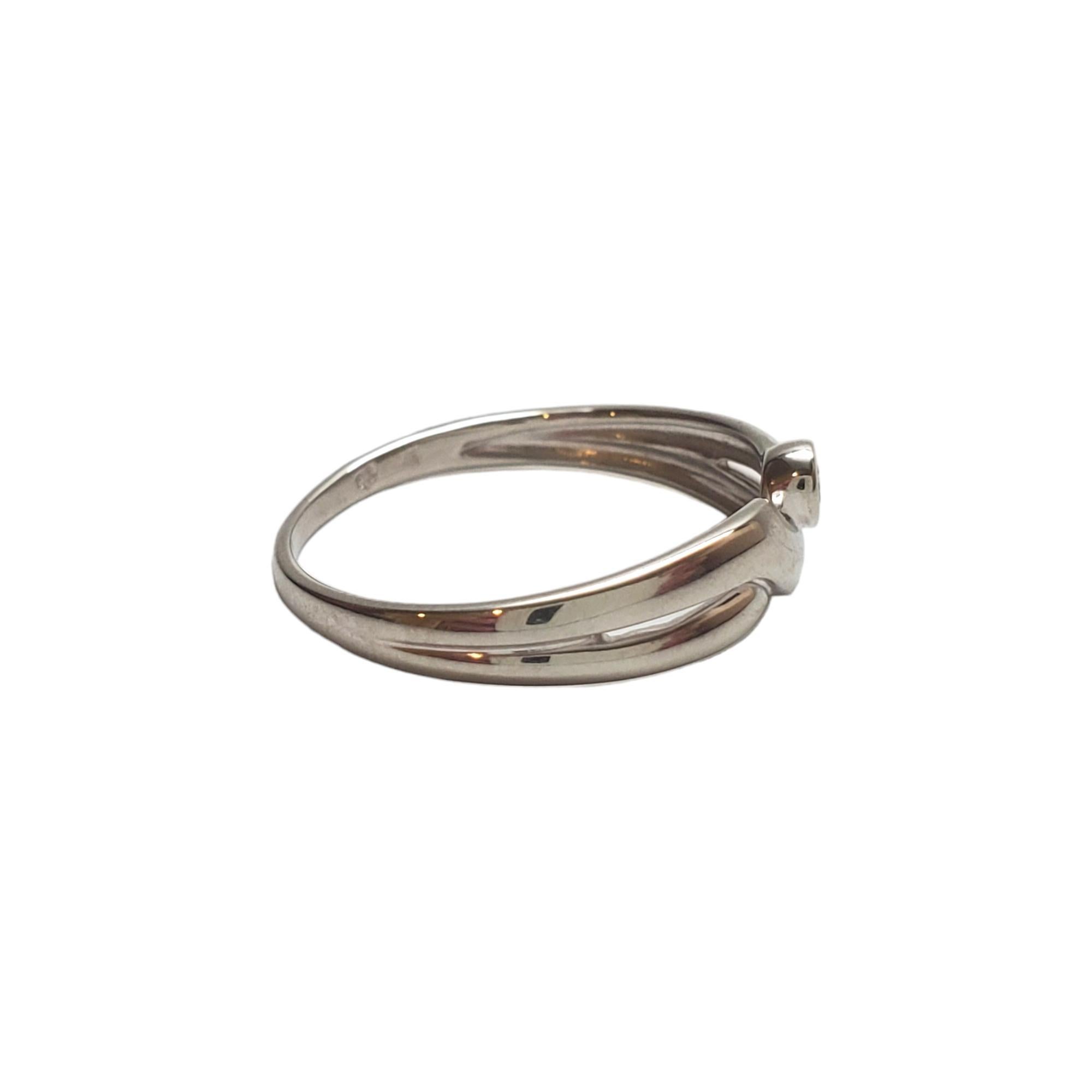 14K White Gold Diamond Band Ring Size 7

White gold ring with round brilliant cut bezel set diamond in center.

Hallmark: 14K

Weight: 1.4 g/ 0.9 dwt.

Ring Size: 7

Shank: 1.4 mm

Size: 18.8 mm X 5.0 mm X 2.0 mm

# of Diamonds: 1

Carat Weight: .04