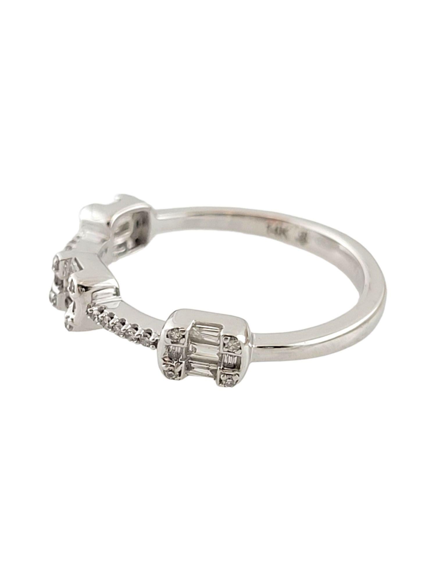This gorgeous band is crafted from 14K white gold and features 22 sparkling, single cut diamonds surrounding 15 beautiful baguette cut diamonds!

37 diamonds total

Approximate total diamond weight: .16 cttw

Diamond clarity: SI1-I2

Diamond color: