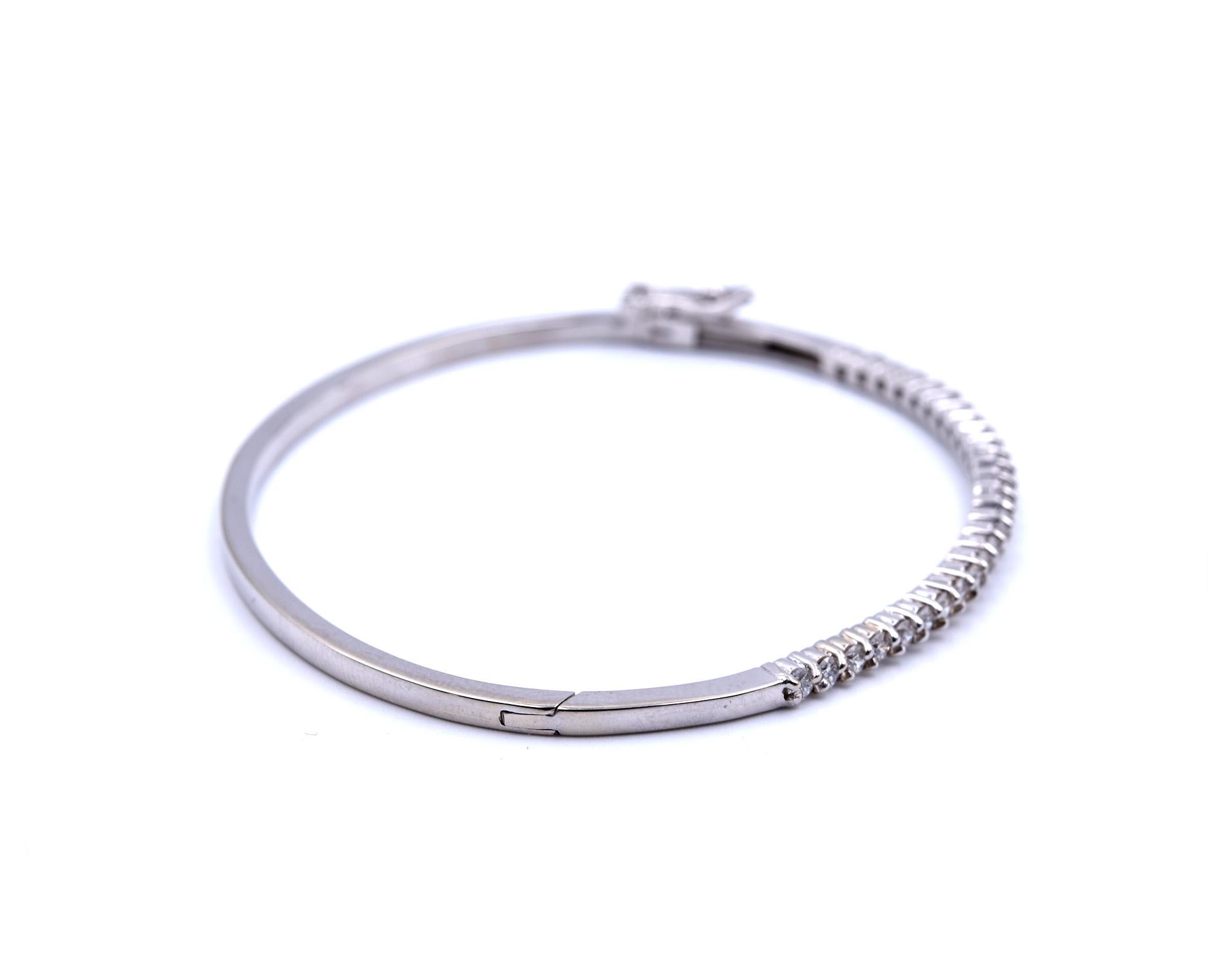 Designer: custom
Material: 14k white gold
Diamond: 27 round brilliant cut = 1.37cttw
Color: G
Clarity: SI1
Dimensions: bracelet will fit a 7-inch wrist and it is 2.30mm wide
Weight: 10.15 grams
