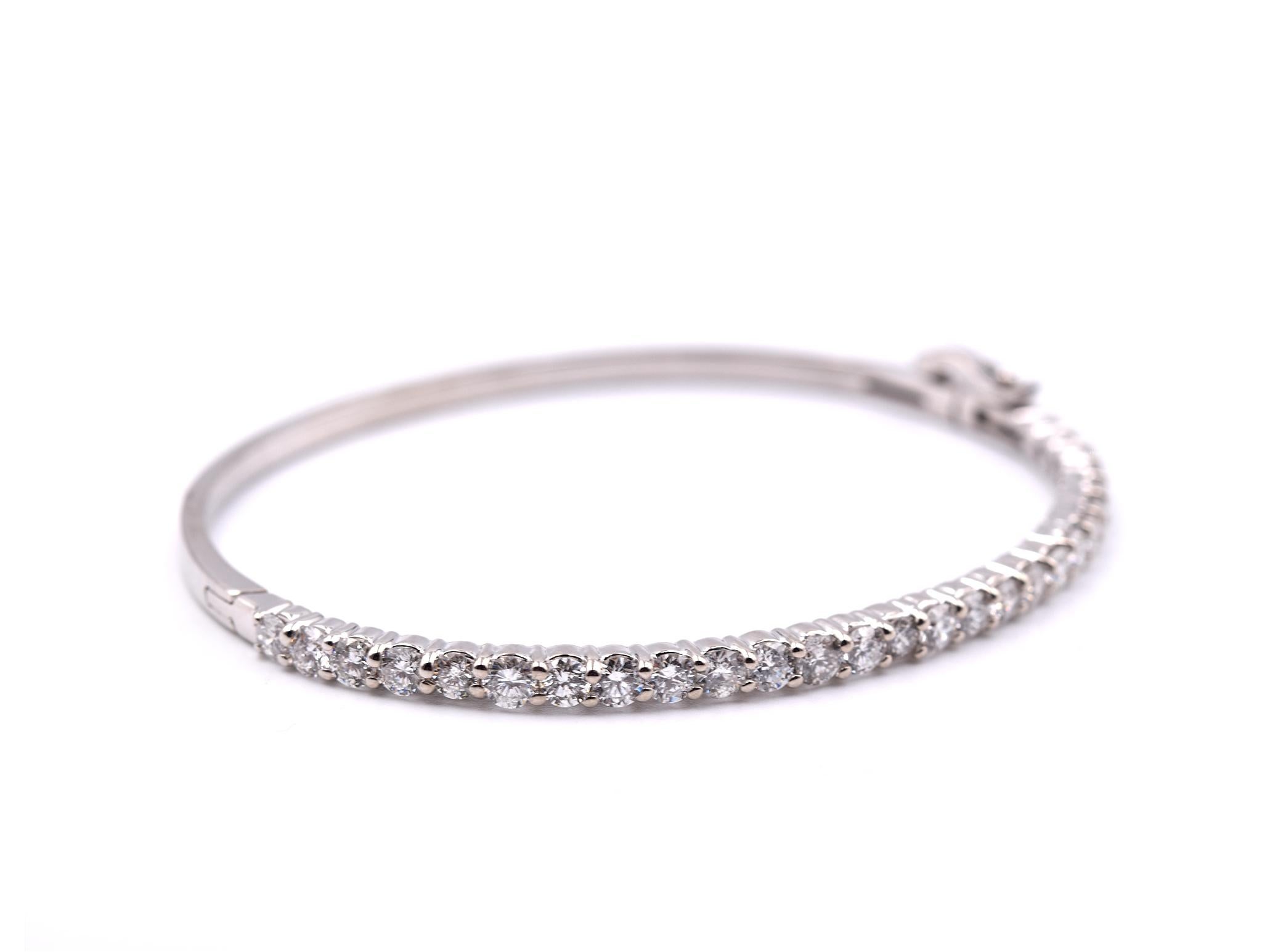 Designer: custom designed
Material: 14k white gold
Diamonds: 27 round brilliant cut= 2.66cttw
Color: G
Clarity: VS
Dimensions: bracelet will fit a 6 ½ inch wrist and it is approximately 3.12mm wide
Weight: 11.08 grams

