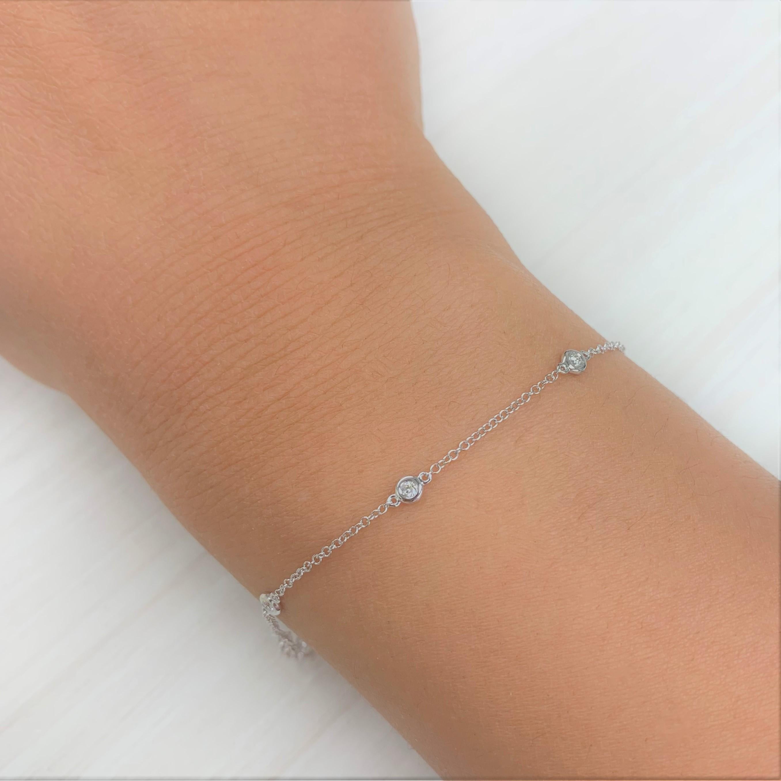 Diamond Station Bracelet: Focused on design and detail, this diamond Station chain bracelet for her features 0.10ct Natural Diamonds and is crafted in 14k white, yellow or rose gold. Diamond Color and Clarity GH-SI1. Bracelet is adjustable 6.5