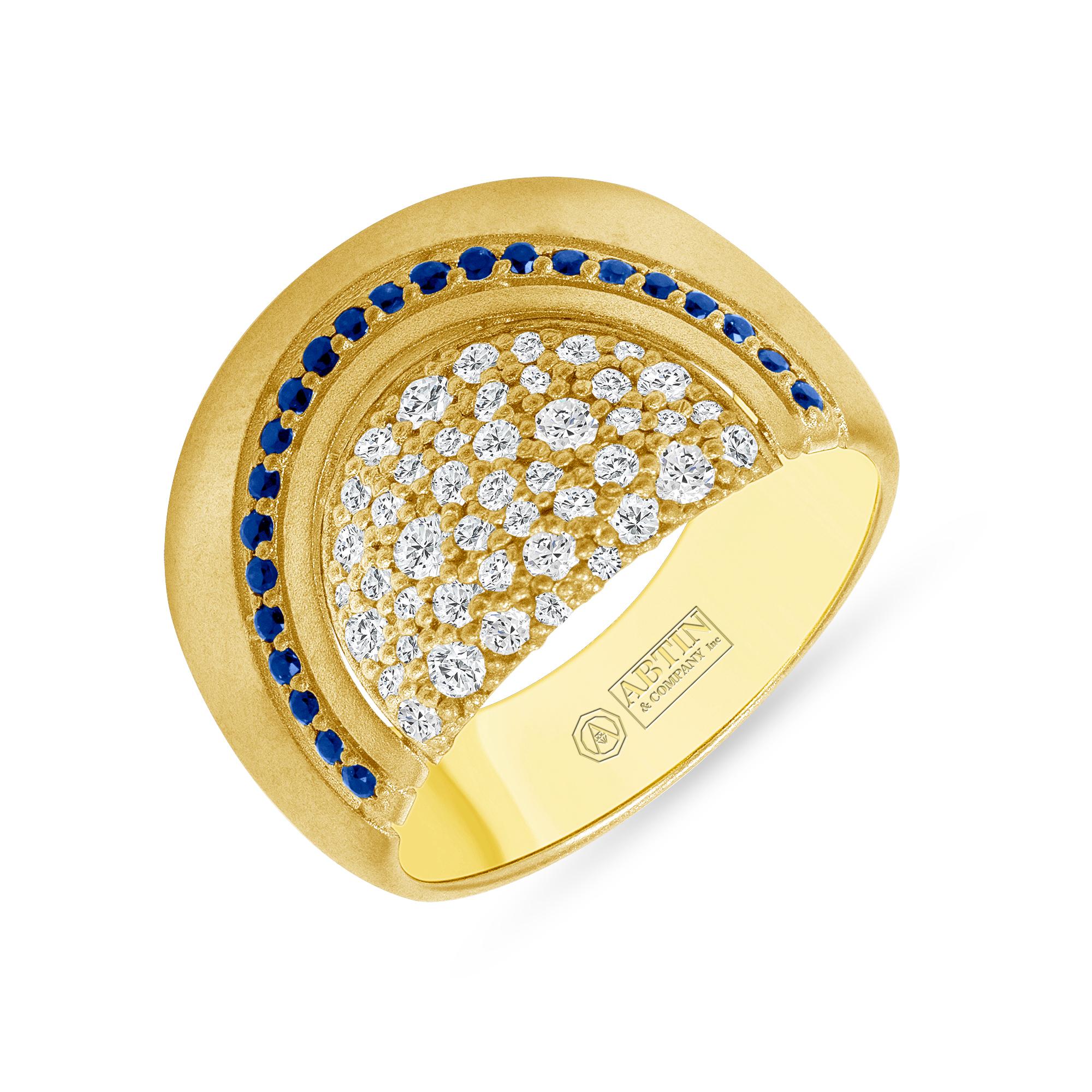Crafted in 14K gold, this exquisite ring features a dazzling arrangement of 0.68 carats of diamonds and blue sapphire. Its high-domed design sparkles with round brilliant-cut diamonds and round-cut blue sapphire. The rich, satin blue of the blue