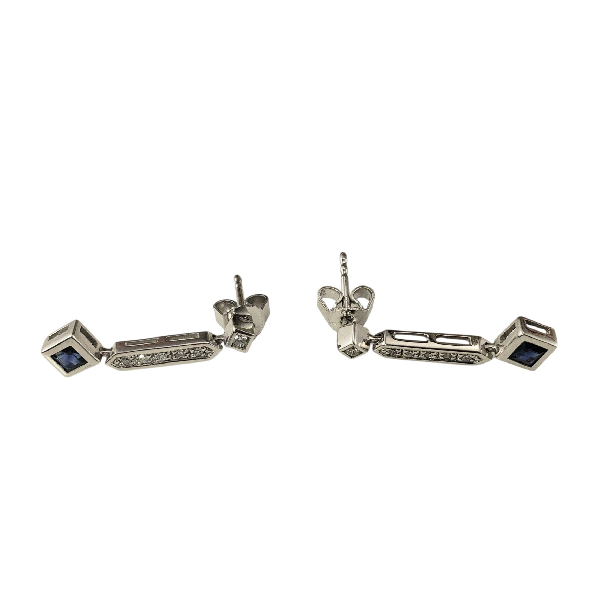 14K White Gold Diamond and Blue Stone Earrings

Elegant and modern, these 14K white gold earrings feature a sleek linear design. Each is set with 6 round sparkling diamonds and a square faceted blue stone that add a vibrant pop of color. Push back