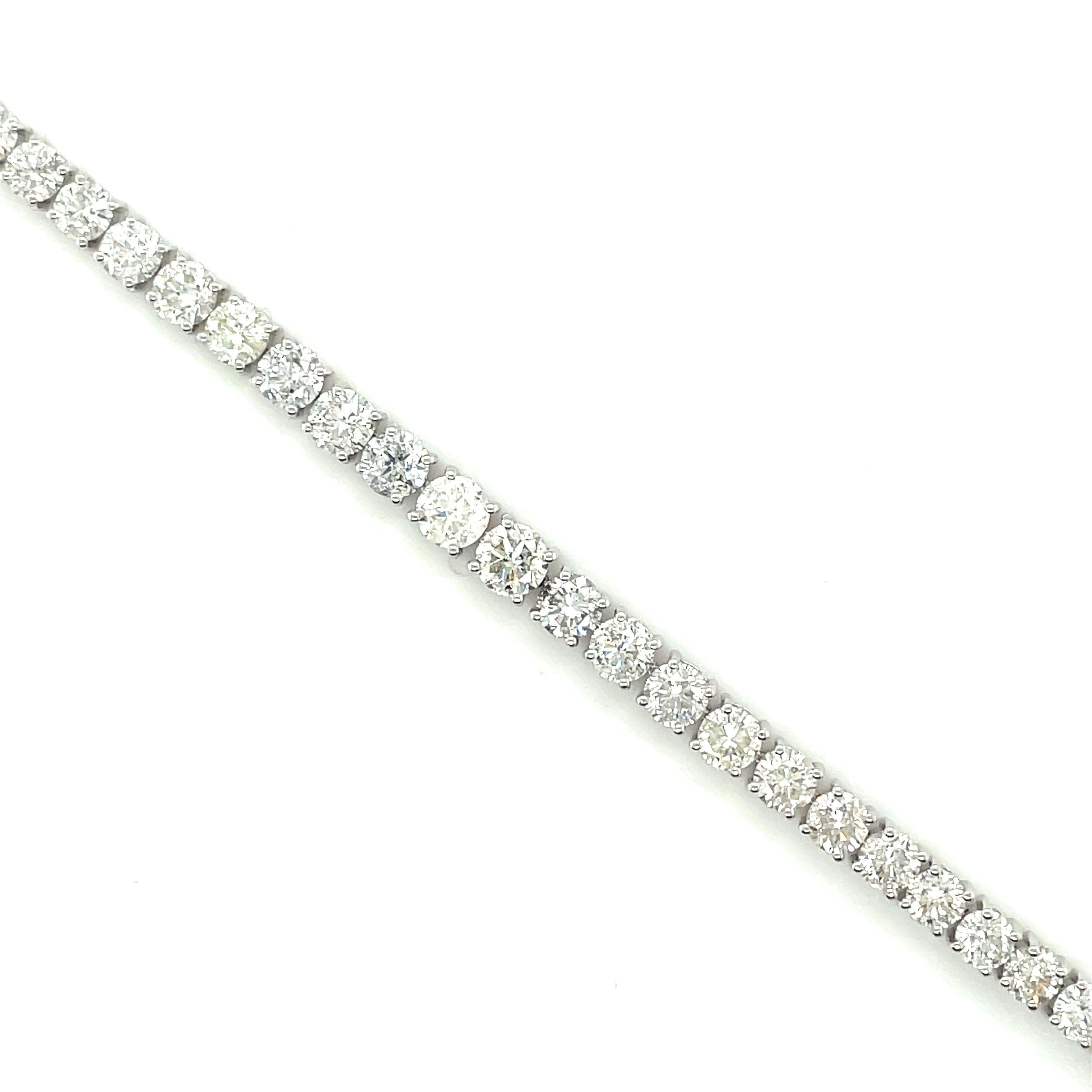 14K White Gold Diamond Bracelet

One polished, and tested, 14K white gold bracelet mounted with 46 genuine round diamonds weighing approximately  9.35 carats. The bracelet measures 7 inches in length and is finished with a tension lock clasp and