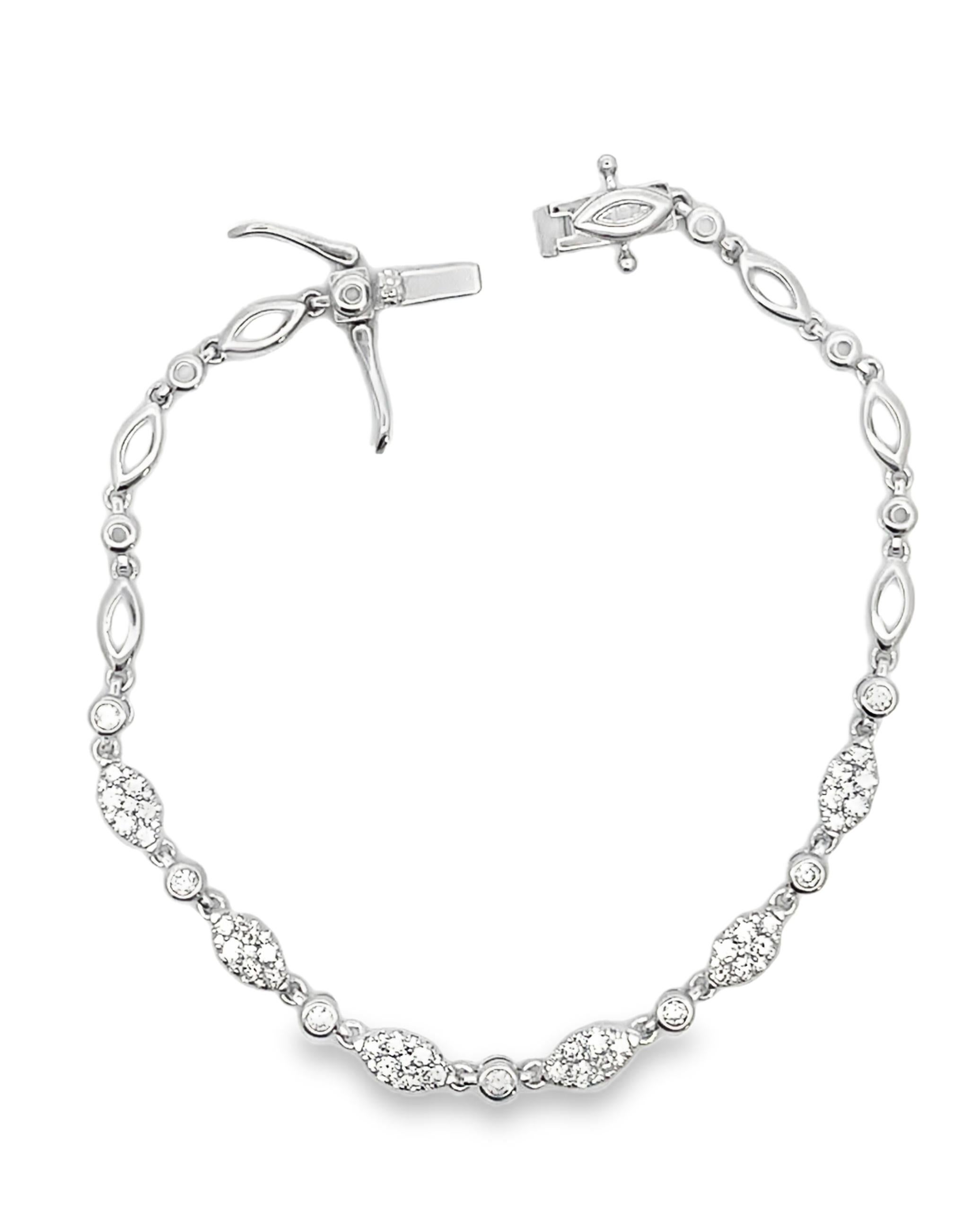 14K white gold diamond bracelet with round faceted diamonds weighing 1.22 carats total.  

- Bracelet is 7 inches long.
- Diamonds are G/H color, SI1 clarity.