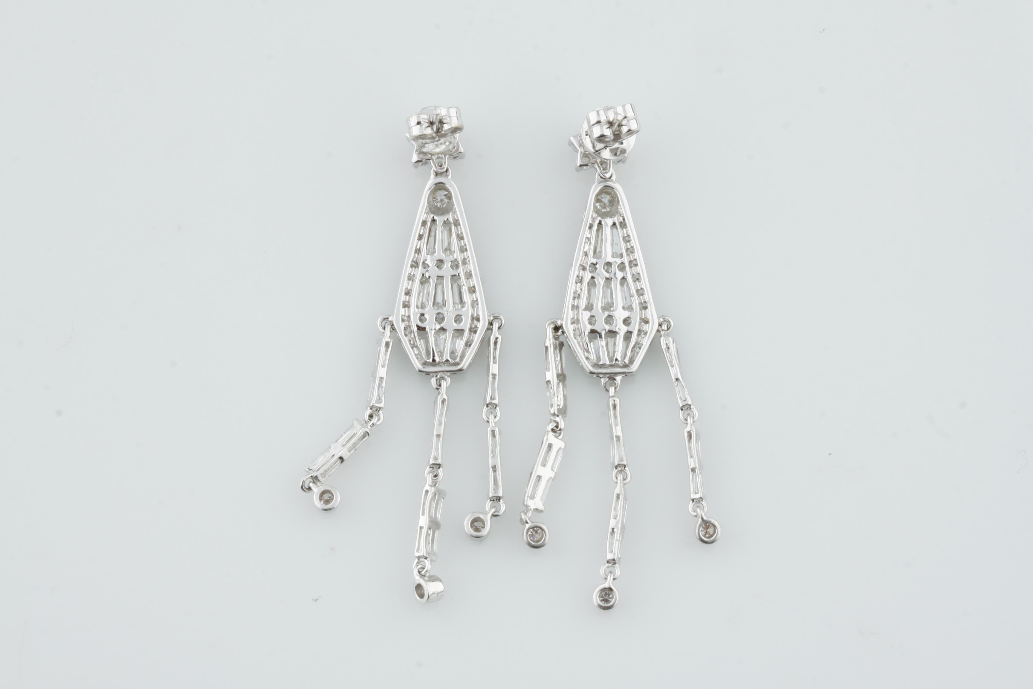 Gorgeous White Gold Diamond Chandelier Earrings
Feature Three Dangling Elements with Baguette Stones
Diamond Floret Post with Butterfly Back
Includes AIG Appraisal Certificate, which reads:
One pair electronically tested 14KT white gold ladies cast