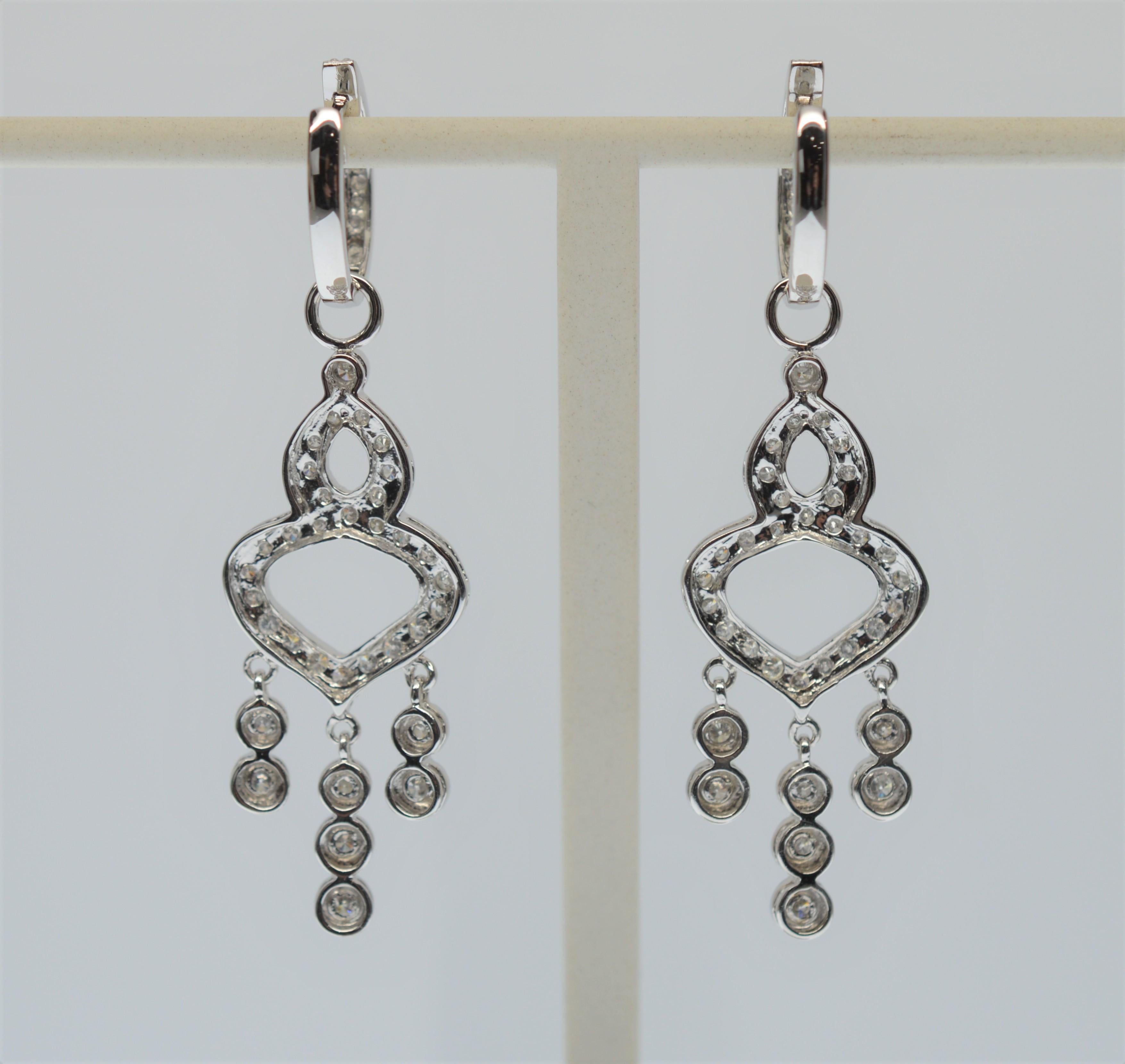 Fancy 14k White Gold & Diamond Chandelier Earrings with huggie- style closure. Total length 2 inches, drop from closure is 1-1/2 inches. 4.7 pennyweight .585 Gold. Total weight 4.9 pennyweight. In Gift Box. 