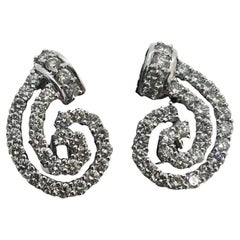 Boucles d'oreilles en or blanc 14k Diamond Channel Swirl Leaver Back