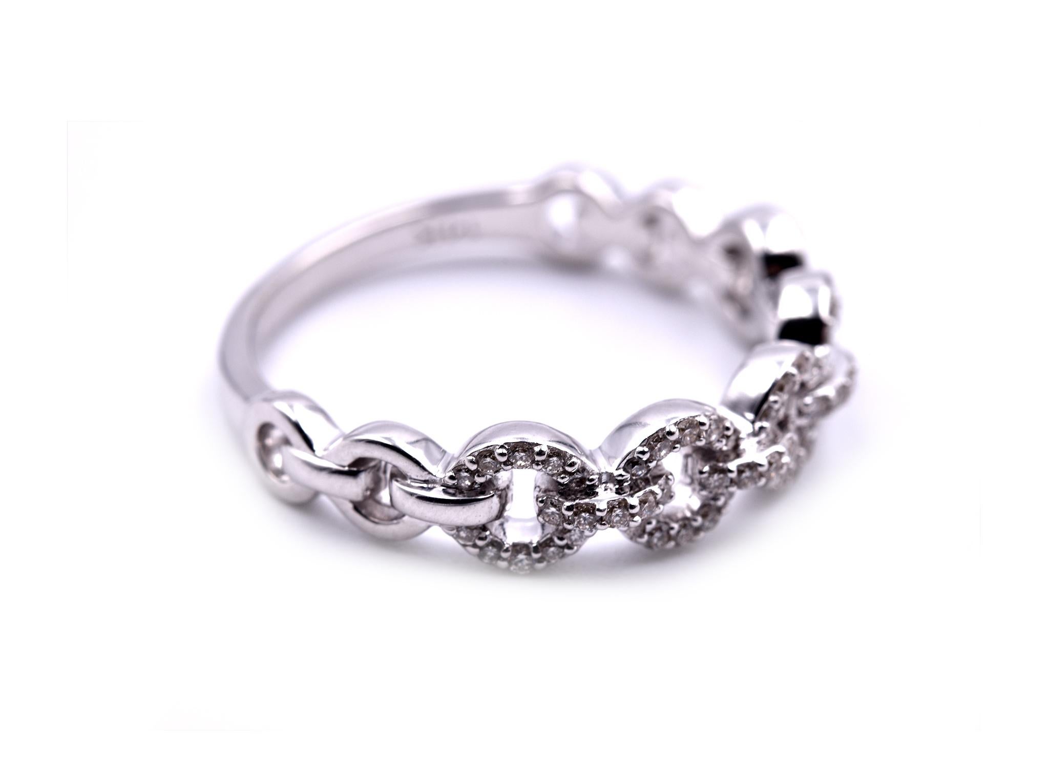 Circle Link Band

Designer: custom design
Material: 14k white gold
Diamonds: 70 round brilliant cut = .25cttw
Color: G
Clarity: VS
Ring size: 7 ¼ (please allow two additional shipping days for sizing requests)
Weight: 3.0 grams 
