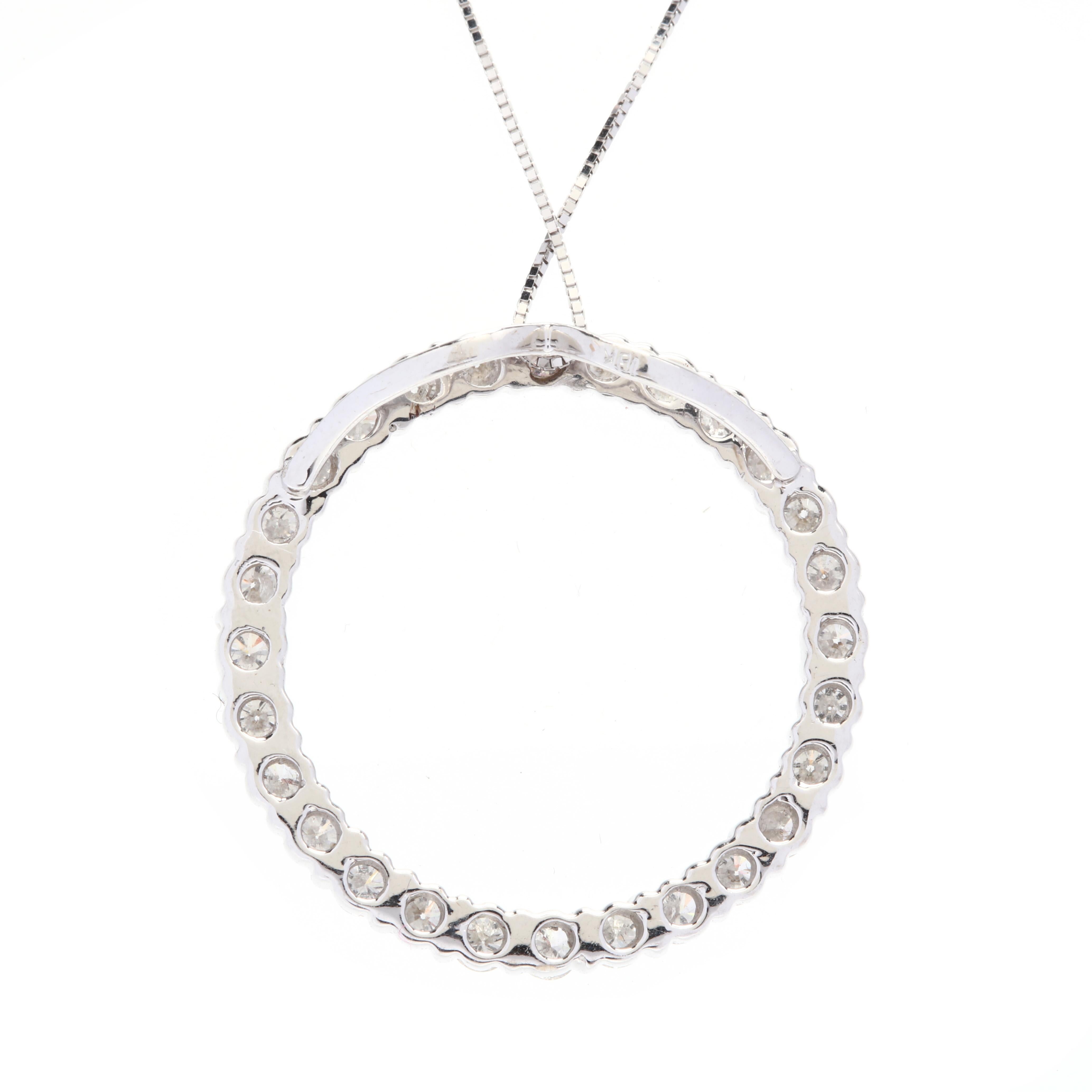 A 14 karat white gold and diamond circle pendant necklace. This necklace features an open circular design set with full cut round diamonds weighing approximately 1.68 total carats and with a hidden bail suspended from a thin box chain.

Stones:
-