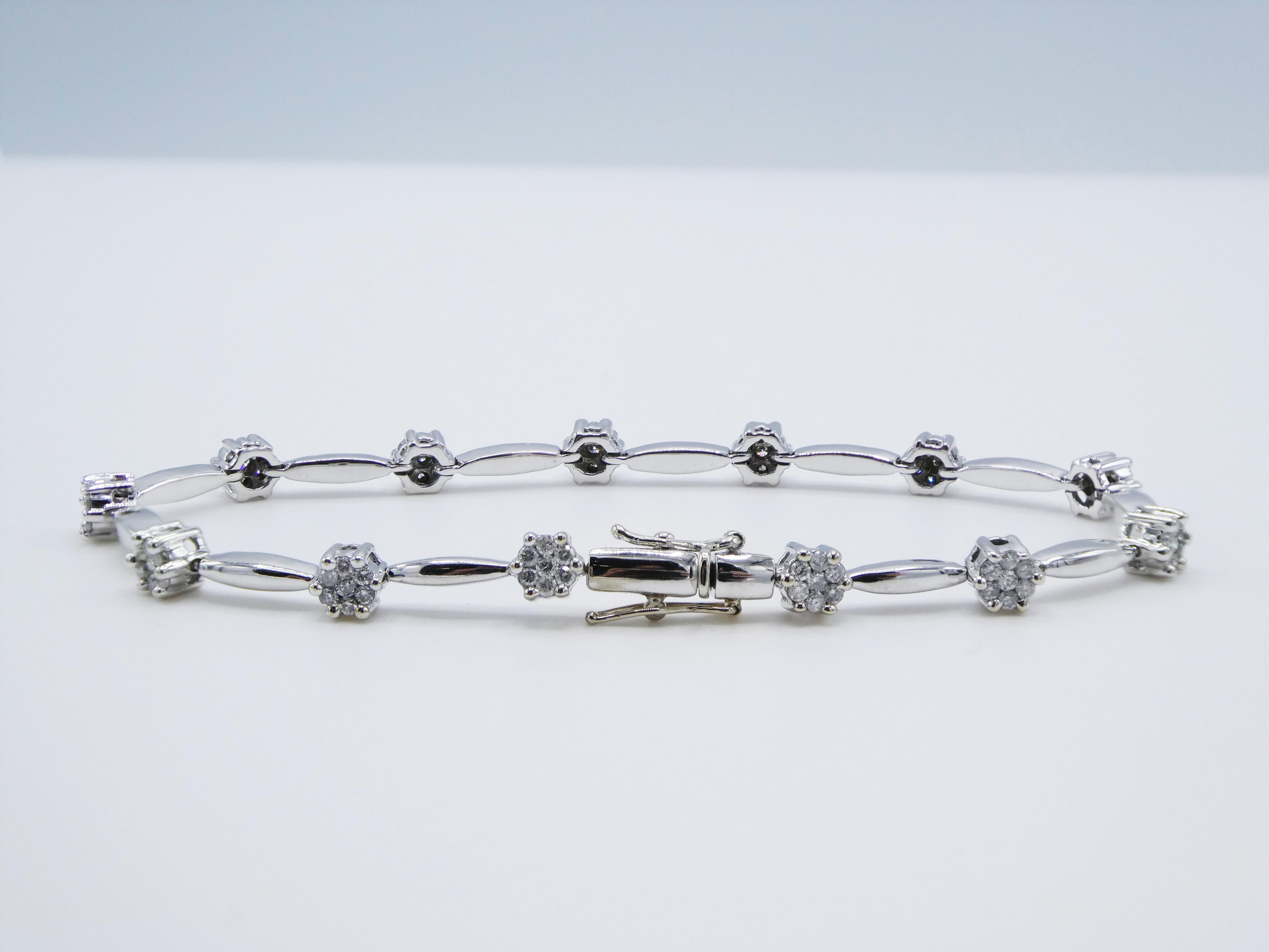 Diamond Tennis Bracelet 14K White Gold 1 CTW Round Brilliant Cut 7 inches

Metal: 14K white gold
Weight: 12.28 grams
Diamonds: approx. 1.00 carat round brilliant cut diamonds G-H SI-I1 91 round brilliant cuts
Length: 7 inches
Width: 4.45mm-2.2mm