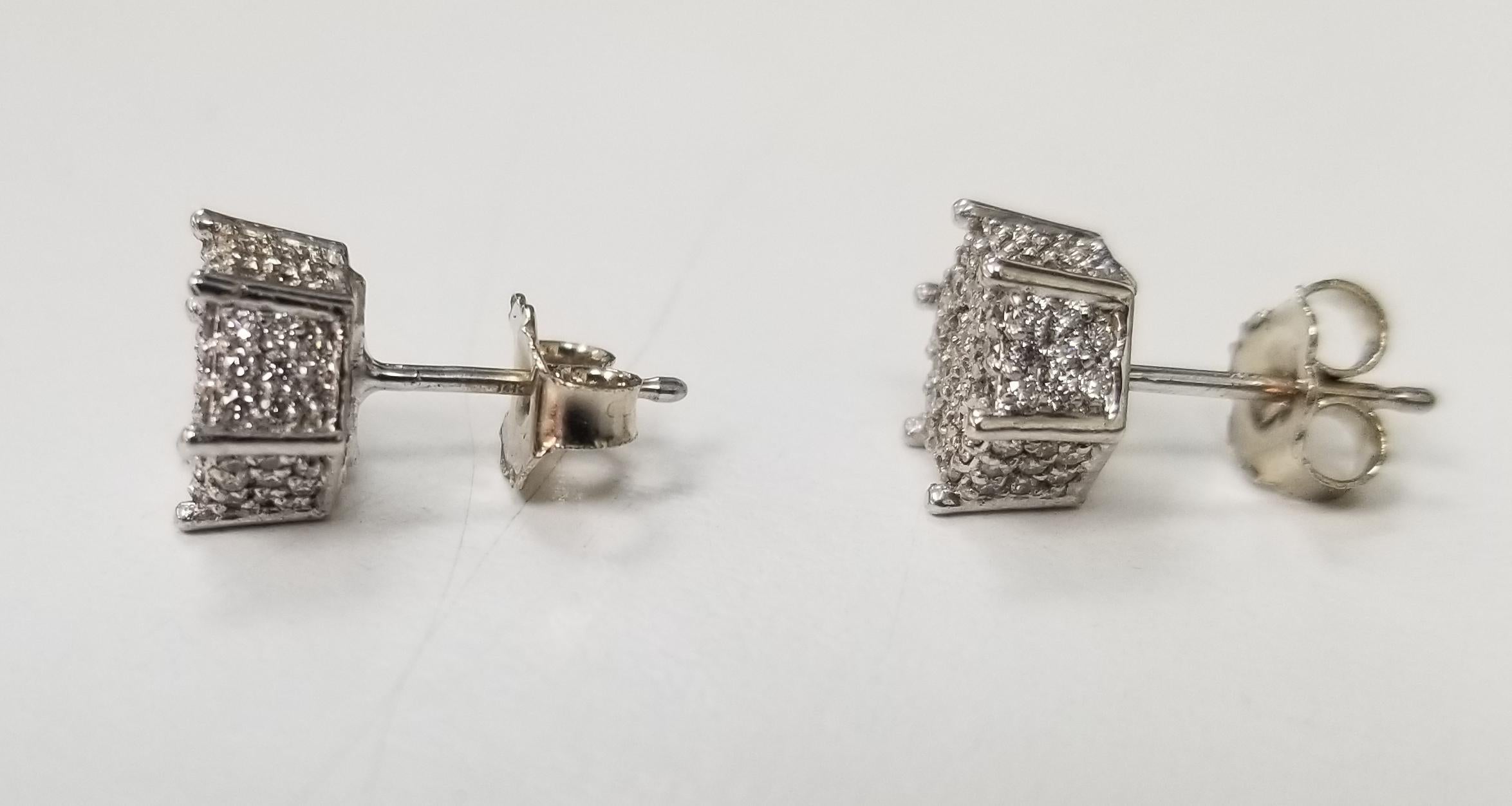 14k white gold diamond  cluster stud earrings .80pts., containing 200 round full cut diamonds of very fine quality weighing .80pts.  diamonds are paved on all 6 sides, making it bling out.