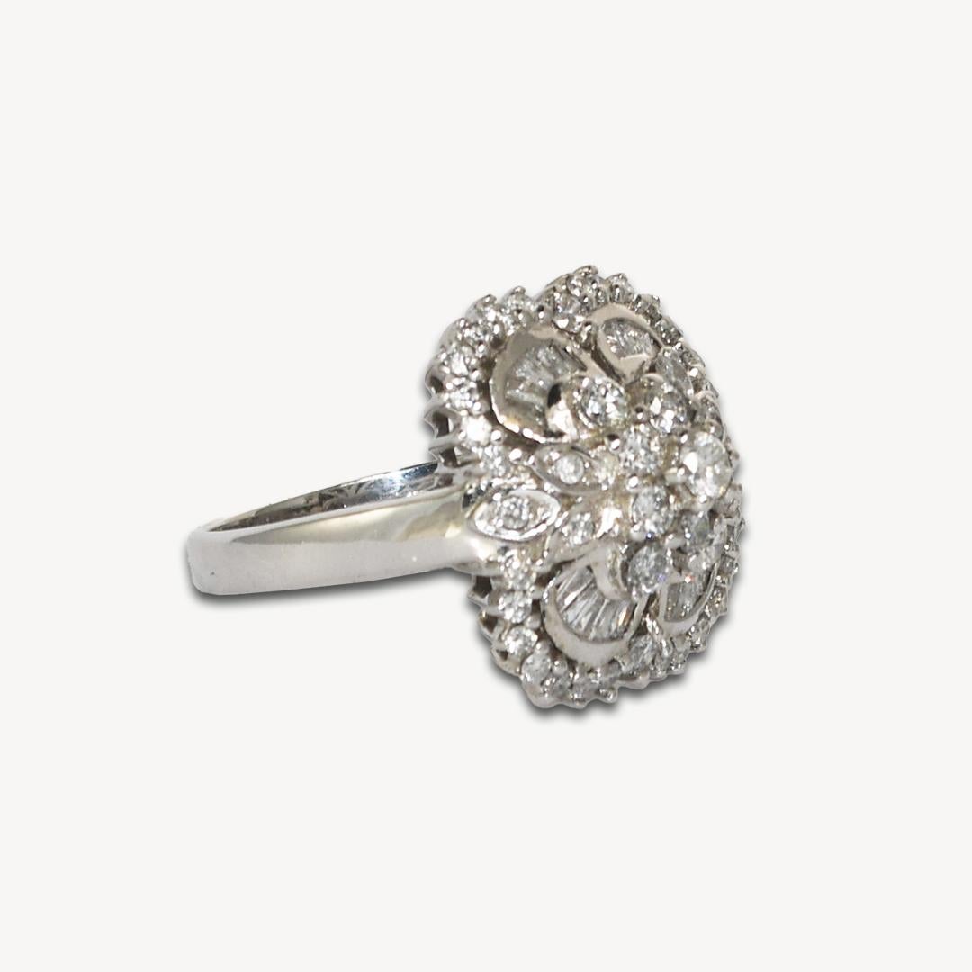 14k White Gold Diamond Cocktail Ring
Stamped 14k and weighs 7.5 grams.
There is small round and baguette cut diamonds, i to j color, si clarity, 1.00 total carats.
Excellent workmanship and in excellent condition. The ring size is 8 1/4 and can be